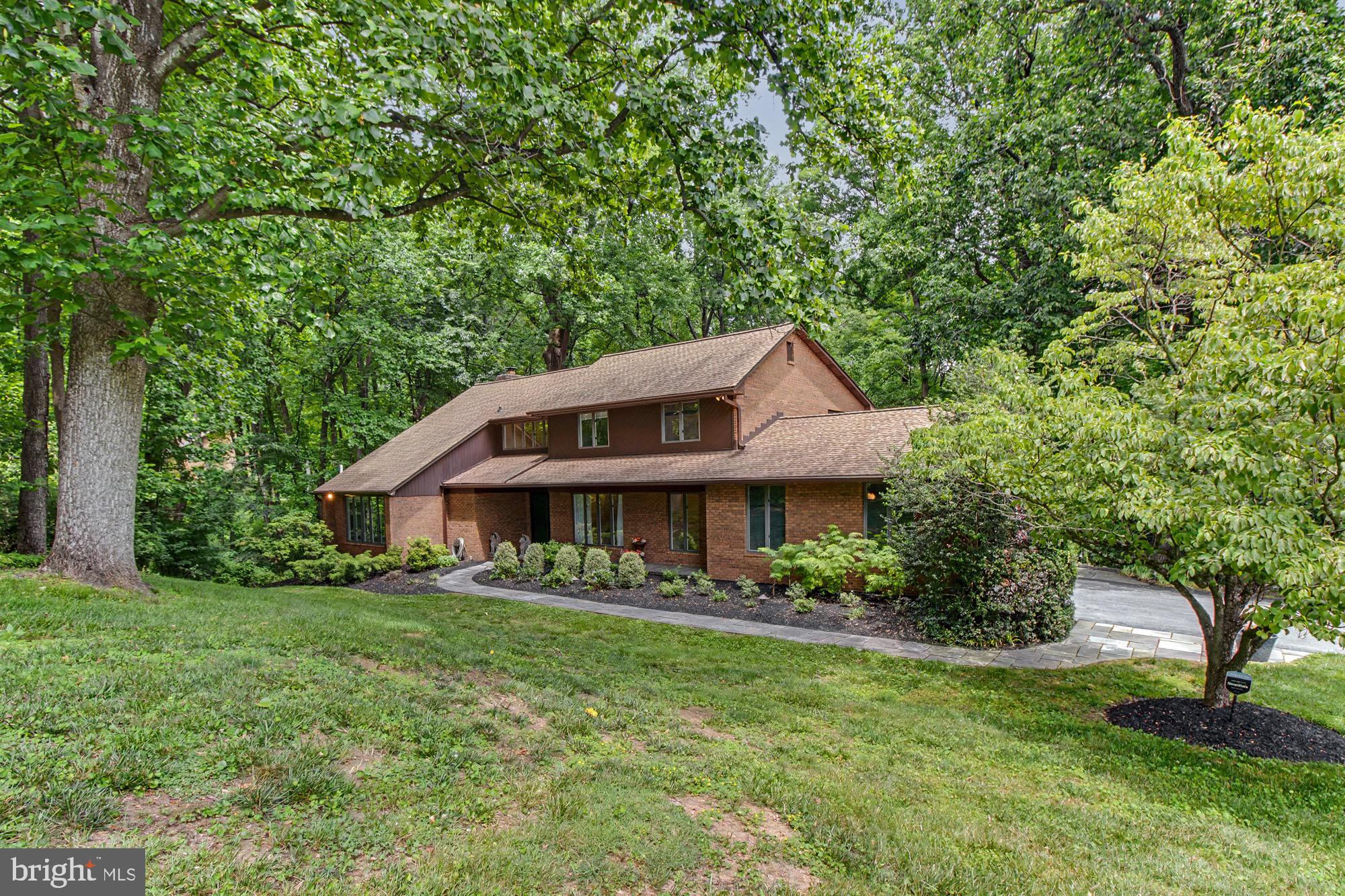 Beautiful 4 Bedroom, 4 1/2 bath home nicely situated on 2.75 acres.  Private, wooded lot.  Renovated bathrooms. Finished basement.  Possible inlaw suite. Stone walkways. Refinished hardwood floors. Newly paved driveway.  Recently replaced roof.  Newly epoxied garage floor.  Located in a highly sought after community.  Convenient to I-83 and I-695.