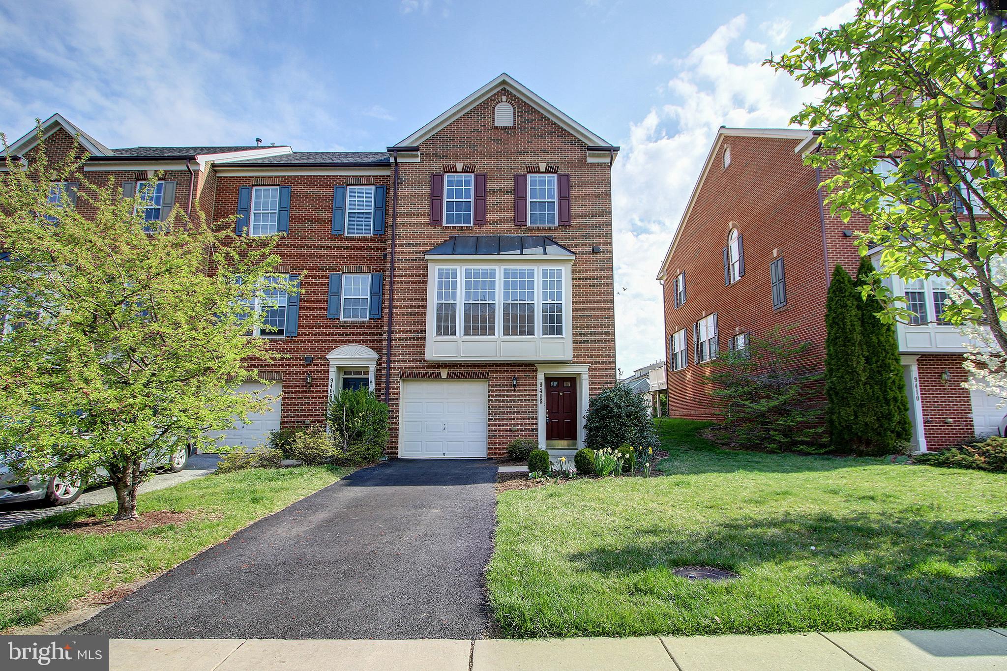 Welcome to 9408 Prospect Hill Place! This charming end unit brick front townhome is located in the desirable Villages of Urbana Community. The community features jogging/walking paths, playgrounds, swimming pool and much more. You are within minutes to commuter routes and public transit and close to shopping and restaurants. The home has over 2,400 square feet of living space with 3 bedrooms, 2 full and 2 half bathrooms including a 1 car garage. Enter on the lower level with garage access, half bath, and a huge rec room. There is also a large laundry/utility room on this level. The main level features hardwood flooring and the living room has large picture windows letting in tons of natural light. The eat-in kitchen features a large island with breakfast bar seating and plenty of storage space. Off the kitchen you have a family room with floor to ceiling stone fireplace. From the family room you have direct access to your huge back deck and yard. The upper level features 3 bedrooms and 2 full bathrooms. The master has vaulted ceilings, walk-in closet and ensuite with soaking tub and double sink vanity. Don't forget to view the virtual tour of this must see home!