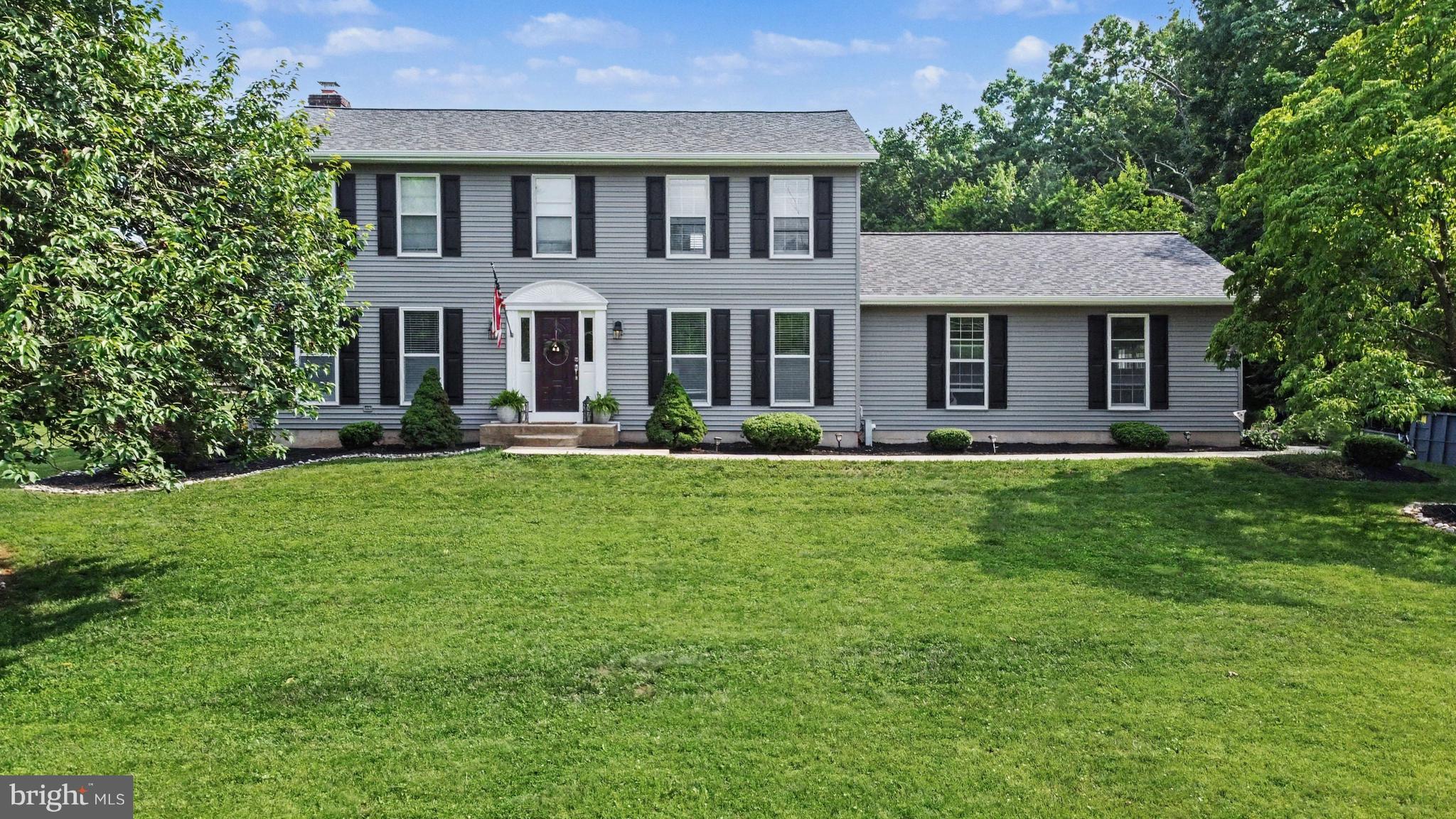 Welcome to 2333 Cox Road — a beautifully renovated colonial tucked away on a picturesque 3+-acre setting combining expansive open space with peaceful wooded surroundings and a private walking trail. From the moment you arrive, this exceptional property impresses with timeless curb appeal featuring brand new siding, a new roof, and a setting that offers the perfect blend of privacy and convenience.
Inside, you’ll find gorgeous hardwood floors flowing throughout the home and a thoughtfully designed layout ideal for both everyday living, working and entertaining. The stunning renovated kitchen is truly the heart of the home, showcasing an oversized extended island, abundant cabinetry, and beautiful finishes that seamlessly connect to the inviting living spaces. Relax in the sun-drenched sunroom overlooking the scenic backyard or gather in the warm and welcoming family room featuring a cozy fireplace. Upstairs, the spacious primary suite offers a luxurious retreat complete with a spa-like super bath and an ample walk-in closet.  Second level laundry and an oversized 2 car garage with ample parking add to the desirable features this property has to offer. 
Step outside to enjoy the deck, hot tub , and the beautifully hardscaped patio complete with fireplace — perfect for entertaining, dining al fresco, or simply enjoying the peaceful natural surroundings. The expansive level lot offers endless possibilities while the wooded backdrop and private walking trail create a truly special setting rarely found.
A plethora of upgrades, flexible space, an exceptional lot, and an excellent location make this home an absolute standout! This property comes within an additional 1.04 acre lot making the total amount 3.34 acres! The additional acreage is reflected in a separate tax ID and tax bill