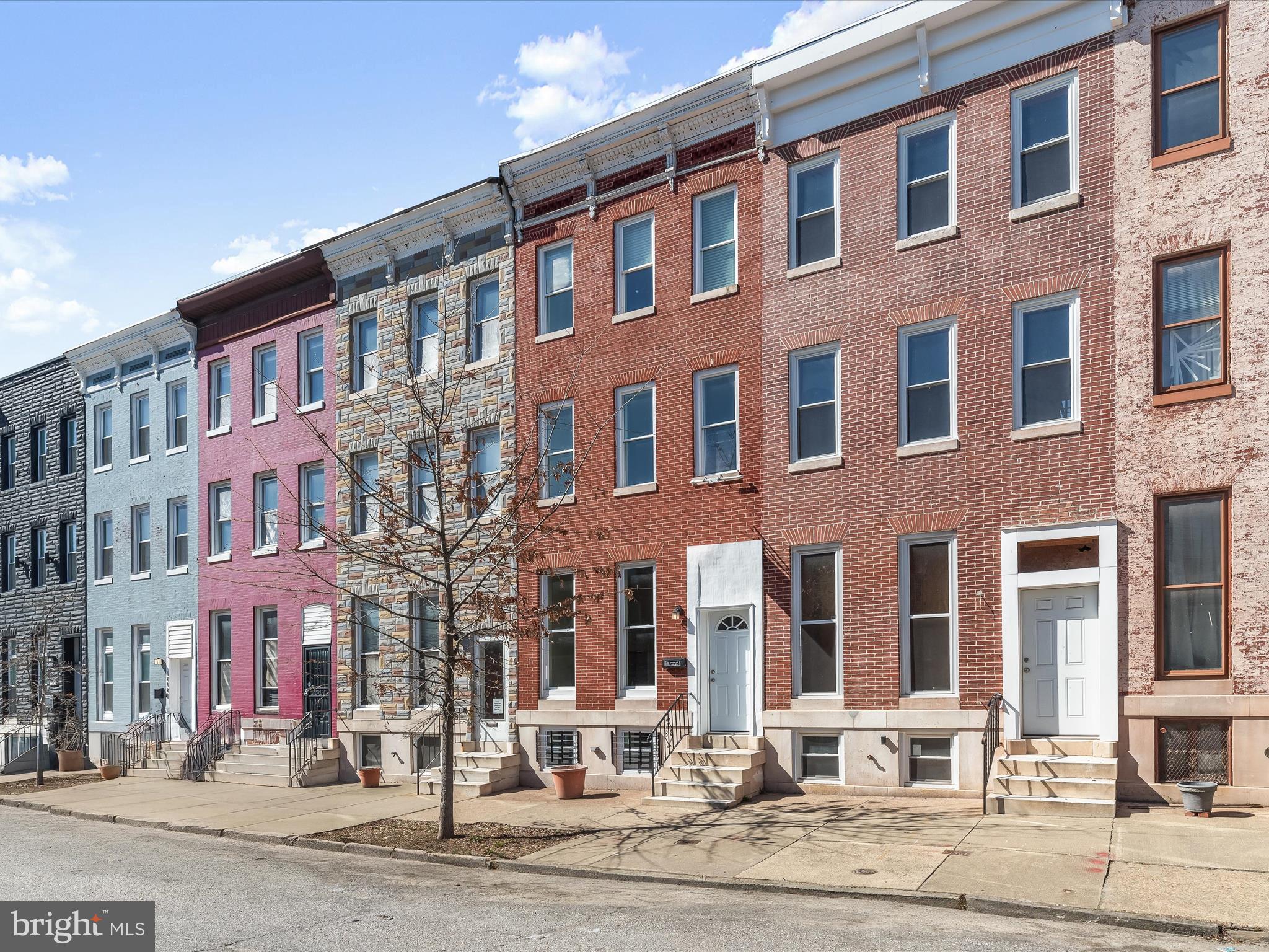 Experience timeless elegance and modern comfort in this beautifully renovated brick townhome in Northeast Baltimore! Step into the inviting living room, where a gas fireplace with a ceramic tile surround, soaring 9-foot ceilings, decorative molding, and floor-to-ceiling windows create a warm and sophisticated ambiance. Gorgeous hardwood floors flow seamlessly throughout, leading you to a private dining room tucked behind elegant glass French doors. Enjoy effortless indoor-outdoor entertaining from here with direct access to the fenced rear patio.  At the heart of the home, the thoughtfully designed kitchen impresses with granite countertops, 42” cabinetry, a breakfast bar, and a central layout perfect for both preparing gourmet meals and gathering with loved ones. A convenient powder room completes the main level.  The penthouse-level primary suite is a serene retreat, filled with natural light and featuring double closets, custom blinds, and a spa-like en-suite bath with a jetted soaking tub, a transom window, and a ceramic tile walk-in shower. Three additional spacious bedrooms and a well-appointed hall bath complete the upper level.  The fully finished lower level offers endless possibilities with recessed lighting, a dedicated office space, and an additional bedroom suite—ideal for guests or multi-functional use.  With easy access to I-695, I-895, and I-95, commuting to points north and south is a breeze. Don’t miss this opportunity to own a beautifully updated home in a prime location!
