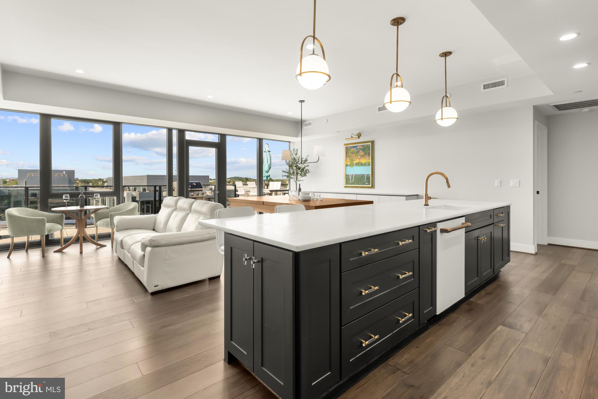 BEST LUXURY VALUE ON THE WATERFRONT!  Big, beautiful 3 BR + Den with overized terrace and a great view!

Gaze over the SW waterfront from the expansive private terrace of this stunning 3 BR + Den Penthouse.

Framed by a wall of glass that blurs the lines between indoors and out, PH02 offers breathtaking skyward views and an eastern exposure that gifts you with warm, colorful sunrises and naturally cooling midday tones perfect for al fresco dining, entertaining guests, or simply unwinding in tranquil serenity.

Inside, the open-concept living, dining, and entertainment area provides an exceptional flow for hosting and everyday living. The thoughtfully customized chef's kitchen is a culinary dream, featuring upgraded Café appliances, sleek stone countertops, Thomasville cabinetry with soft-close drawers + gorgeous hardware and under-cabinet lighting.

Each generously sized bedroom offers a private en-suite bath with its own unique and tasteful style, along with ample storage space. A separate study offers flex space for an extra guest, work or workouts.

Every detail of this home exudes modern luxury, with designer touches, high-end features and finishes, and custom built-ins throughout. Expect chic surprises around every corner! Enjoy conveniences such as wine storage, Elfa closet systems, and a combination laundry room and pantry complete with a coffee station. The home conveys with two secure adjoining underground garage parking spaces close to the elevator.

THE BOWER: PREMIER NAVY YARD LIVING

The Bower is the premier condominium in the Navy Yard, perfectly positioned on Tingey and 4th Street, surrounded by an array of dining and shopping options. Residents enjoy access to:

*24 hour concierge service
*A well-equipped fitness studio
*Elegant rooftop lounge with wraparound terrace
*Gas fireplace & Grill
*Kitchen & dining space
*Lounge & Entertainment center


EXPLORE THE VIBRANT NAVY YARD

The historic waterside Navy Yard district offers an fun and unique lifestyle:

*Boating and water sports
*Nationals Park baseball stadium
*Outdoor recreation areas
*Trendy sports bars and beer gardens
*The Anacostia Riverwalk Trail
*The Yards Park boardwalk
*Waterfront cafe dining and summer concerts

With a wide variety of dining spots, boutique shopping, grocery stores, services, and entertainment options right at your fingertips, you'll never have a dull moment. Plus, Audi Field, The Wharf, Barracks Row, Eastern Market, and Capitol Hill are just minutes away.

Effortless Connectivity:

Getting around is a breeze with the Navy Yard Metro station nearby, and Uber & Lyft are readily available. And you can explore the waterfront on neighborhood rental bikes or scooters.

Don't miss the opportunity to own this exceptional penthouse in the heart of the Navy Yard!

Schedule your private showing today.
