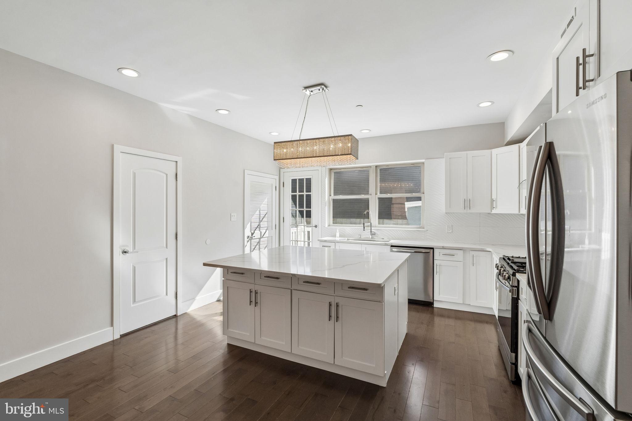 Welcome to 4774 Pechin Street, where modern finishes, generous living space, and incredible outdoor areas come together in the heart of Roxborough. The bright, open layout features hardwood floors, a beautifully appointed kitchen with quartz countertops, stainless steel appliances, and a large center island perfect for everyday living and entertaining. This home offers 3 spacious bedrooms that have all been outfitted with custom closets and ceiling fans. Enjoy additional living space in the finished lower level, attached 2-car garage parking, a private rear deck, and an expansive rooftop terrace. There is still 4 years left on the TAX ABATEMENT for this home. Conveniently located near Main Street Manayunk, parks, trails, shopping, dining, and public transportation, this home offers the perfect blend of comfort, style, and city convenience. All square footage numbers are approximate and should be verified by the buyer. It is the responsibility of the buyer to verify real estate taxes. The listing contains some virtually staged photos.