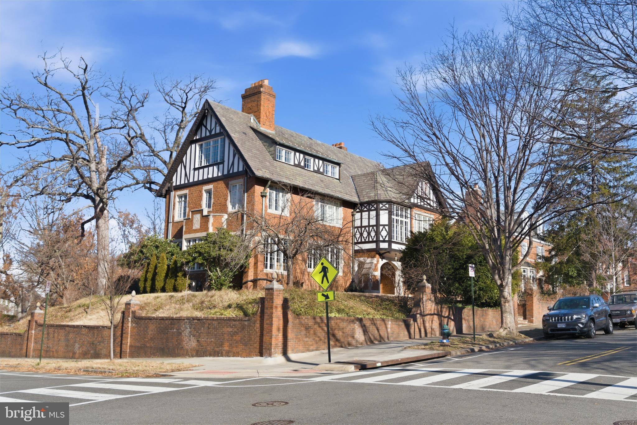 Of all the stunning Tudor Revival residences in Crestwood, this masterpiece has long been considered a star in the neighborhood.  The Grande Dame is sited on a commanding prominent position high on the corner of Decatur St. and Blagden Ave.  With approximately 7,000 square feet of interior space, the home offers six bedrooms (two with ensuite offices), four bathrooms, a powder room, a conservatory, six fireplaces and a two-car garage (with additional parking in the driveway).  The residence has been meticulously renovated and restored with an emphasis on historical preservation.  The interior offers architectural eye candy at every turn: copious original plaster moldings, original millwork, completely reworked casement windows, stunning marble and plaster fireplace mantles, and built-in benches. The kitchen with accompanying butler’s pantry is an absolute showpiece, with high-end cabinets, appliances and finishes. Outside, a large flagstone terrace is perfect for entertaining with its outdoor stainless steel kitchen and numerous spaces for al-fresco dining. Beautifully reimagined to incorporate the original elegance with modern comforts, this exceptional home awaits its new owner.