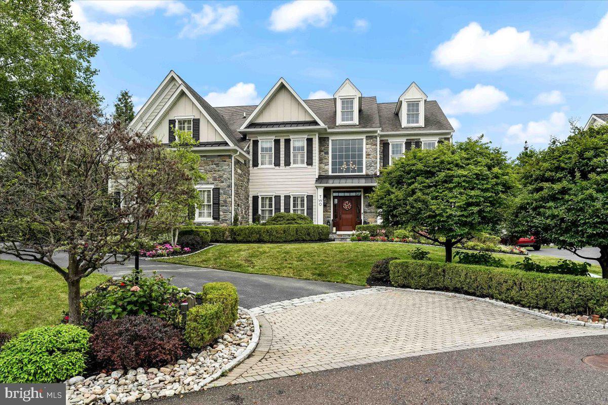 Welcome home to  2 Millview Court, a breathtaking, one of a kind 4 bedroom,  4-1/2 bath Colonial home, nestled in the highly sought-after community of The Estates At Mill Creek and Thornbury Township, situated in the blue ribbon West Chester School district.  From the curb through the interior of this sensational home, every amenity and detail imaginable is present; from the custom paver driveway apron, beautiful lush landscaping, a grand stone and Hardie Plank exterior, enchanting paver and slate walkways and rear patio, beautiful custom millwork and built-ins throughout, gleaming hardwood floors, a functional & bright open floor plan, a fantastic finished lower level complete with a custom wet bar, recreation area, movie area, a home gym, a full bath and much, much more, this home is a one of a kind pleaser. Upon entering the grand towering  2-story foyer with a turned staircase, to the left is a private office with built-ins, perfect for working from home in today's environment. To the right is the formal living room with a cozy gas fireplace and formal dining room - ideal for hosting and entertaining. Continuing on is an astonishing 2-story family room with a gas fireplace , custom built in's, wall of windows plantation shutters and back stairs leading to the second floor, exquisite chefs kitchen and breakfast room with an adjacent sunroom. The first floor also features a convenient powder room and a laundry room leading to the 3-car garage. On the upper level of this fantastic home is a luxurious Master Suite with a tray ceiling, cozy sitting area and a large walk-in closet with custom closet organizers and an en suite Master Bath with an oversized soaking tub, stall shower, double sinks and a private water closet. There are 3 additional spacious bedrooms, one that has an en-suite bath and two that share a hall bath.   The sensational finished basement has a custom wet bar with a wine fridge, recreation area, game area, a movie area, fitness room, a full bath, and plenty of storage as well as bilco door egress.  A fabulous, private slate rear patio with a built-in stone fireplace provides outdoor living space. This home is conveniently located to shopping and restaurants and is a must see for the family looking for that special turn-key home  with nothing to do but move right in and enjoy every amenity this fantastic home and community have to offer.  Schedule an appointment today before its too late !!