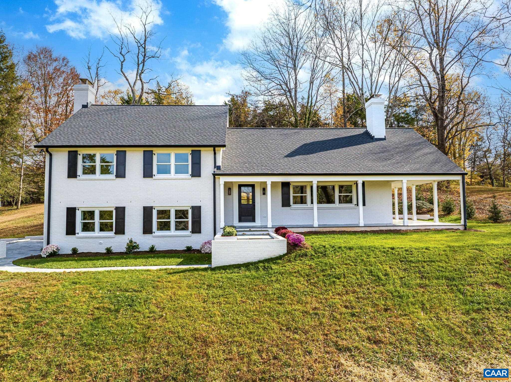 This newly remodeled 5-bedroom, 4-bath residence blends modern luxury with timeless craftsmanship. Recent updates include a new roof, gutters & guards; all-new electrical, plumbing & HVAC ducts; Andersen windows; custom kitchen & baths by Dovetail Design & Cabinetry, Quartzite Countertops, GE Profile & Bosch appliances; Refinished Wood floors, new LVT; and pre-wiring for high-speed internet.  Inside, the open floor plan includes a spacious living room with a fireplace, a gourmet kitchen with quartzite countertops and custom cabinetry, a large dining area, a family room with a fireplace, and generously sized bedrooms. The lower-level bedroom offers private access, ideal for an au pair or In-Law suite. All four baths are fully customized with high-end finishes and radiant heat tile flooring. Custom Closet systems by local designer, Charlotte Wolfe. Set on an elevated 1.95-acre lot, the property provides views toward the Birdwood Golf Course and Ragged Mountain, steps away from Foxhaven Farm and miles of hiking trails. Outdoor living is enhanced with a wraparound porch, flagstone terrace, and a private entertaining area. A detached 2-car oversized garage with storage/workshop adds convenience.,Fireplace in Family Room,Fireplace in Living Room
