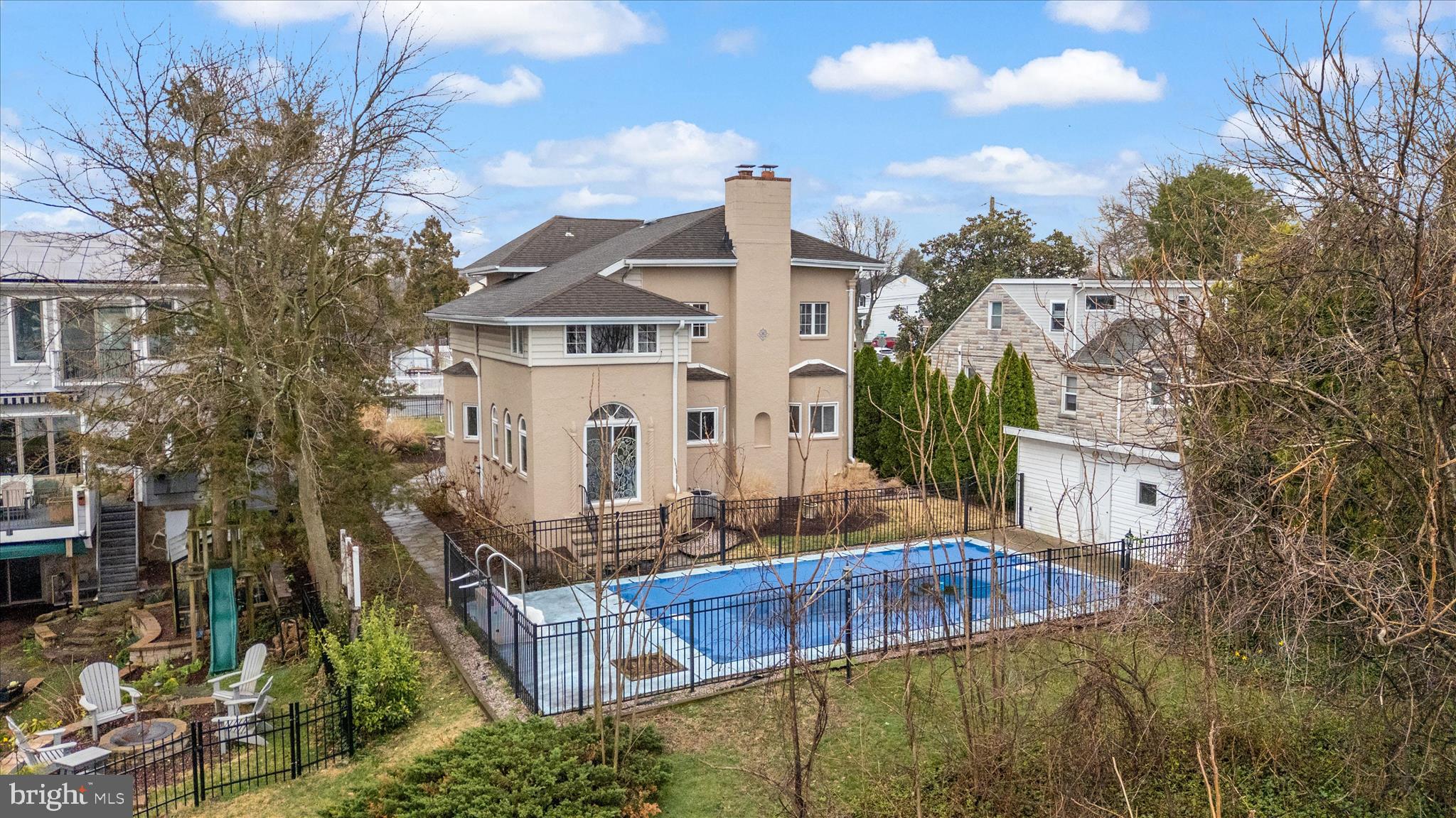 Experience the beauty of the Chesapeake Bay lifestyle from this non-riparian waterfront home offering sweeping views of Stoney Creek and the iconic Stoney Creek Bridge, just moments from the mouth of the Bay. The setting is truly exceptional, with a slope to the water, lush landscaping, and a charming pond creating a peaceful, park-like environment. Enjoy outdoor living at its finest with an inground pool on the water side—perfectly positioned to soak in the incredible views. The pool is now open! Whether relaxing poolside or entertaining guests, this property delivers a rare combination of scenery and space. Inside, this spacious home of yesteryear is filled with character and charm. The large kitchen with eating area opens to a formal dining room with a bay window and wood floors. The expansive great room features two bay window nooks, wood floors, and a stunning stone fireplace with mantel, creating a warm and inviting gathering space. A sunroom with arched windows and stone floors offers breathtaking water views year-round—an ideal spot for morning coffee or unwinding at the end of the day. The lower level includes a huge rec room with a powder room  providing even more space to relax or entertain. Upstairs, you’ll find three generously sized bedrooms and a full bath. Basement level has full bath, storage, laundry, and workshop area.  Adding to its unique appeal, this home carries a bit of local history—once the residence of Judge Rushworth. The community offers a boat ramp, pier with slips, beach, tot lot, picnic area, and more. Recent updates include a replaced boiler and water heater, and mini-split systems in some rooms for added comfort. This is a rare opportunity to own a waterfront property with unforgettable views, timeless character, and incredible outdoor living space—all in a convenient location near shopping, dining, and major commuter routes. Come experience the view for yourself—you won’t want to leave.