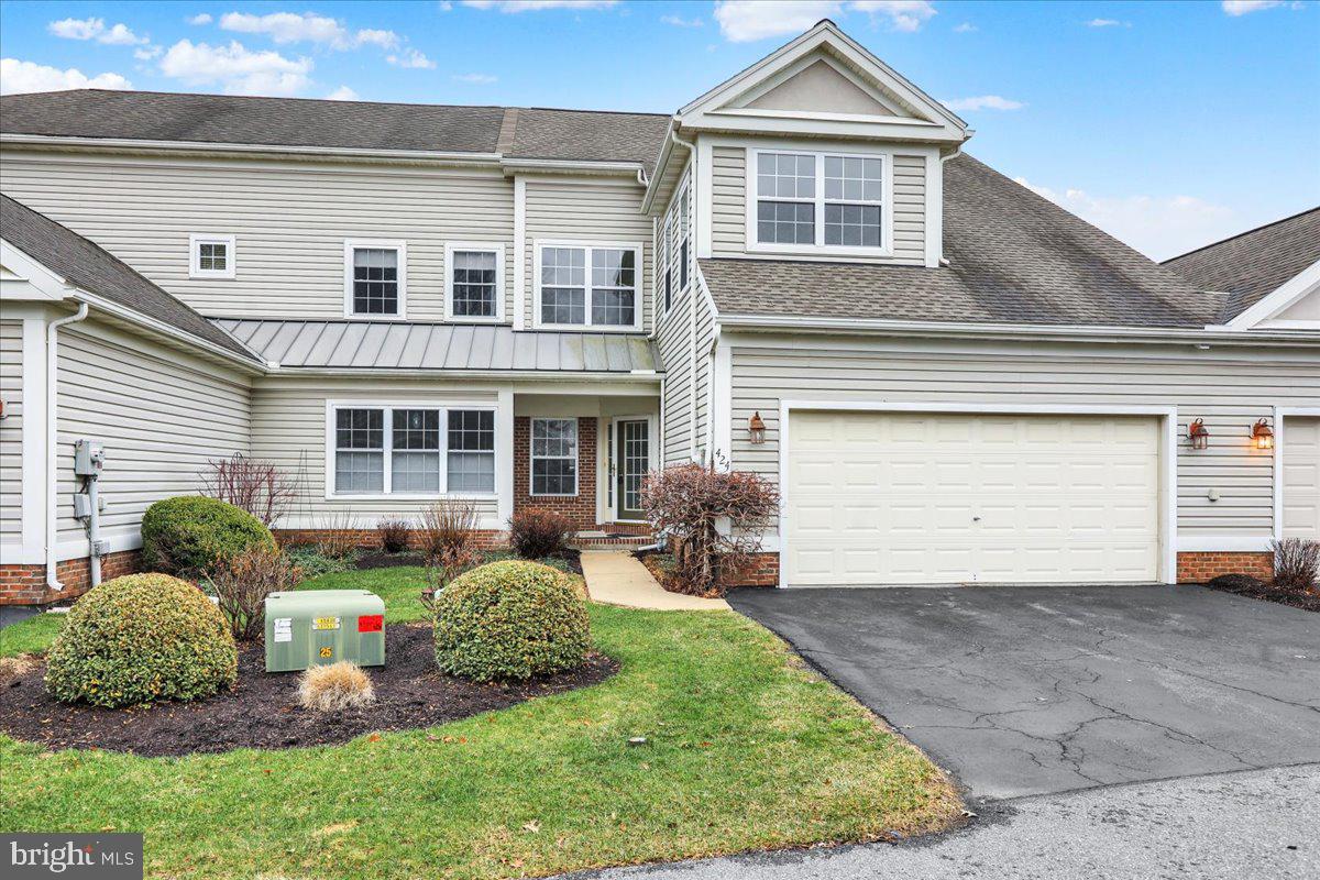 Welcome to 424 Oak Hill Lane, a fully renovated townhome with a two-car garage within the highly desirable Oak Hill at Spring Ridge community in Spring Township. This home has been thoughtfully transformed with quality upgrades and modern finishes throughout. Recent improvements include brand new and upgraded Stainmaster carpeting, three coats of fresh neutral Sherwin Williams paint, and a complete kitchen renovation featuring 15-inch-deep IKEA cabinetry (25-year warranty), Colonial marble countertops (20-year warranty), and brand new GE Profile stainless steel appliances. Professional carpentry enhancements created an open flow between the kitchen and dining room, enhancing both functionality and entertaining space. A brand new sliding glass door leads from the living room to a brand new, extended 16' x 10' Timber Tech deck, perfect for outdoor enjoyment. The open concept living and dining area is highlighted by vaulted ceilings and abundant natural light, offering an inviting space for gatherings. The main-level primary suite is spacious and bright, featuring vaulted ceilings, ample closet space, and a fully renovated, modern en-suite bathroom. A powder room, laundry room, and interior access to the two-car garage complete the first floor. The second level offers two additional bedrooms, a full hall bath, and a versatile 15' x 10' loft area ideal for a home office, sitting area, or flex space to suit your needs. Conveniently located near major routes, schools, parks, shopping, and dining, this move-in ready home combines style, comfort, and accessibility. Schedule your private showing today.