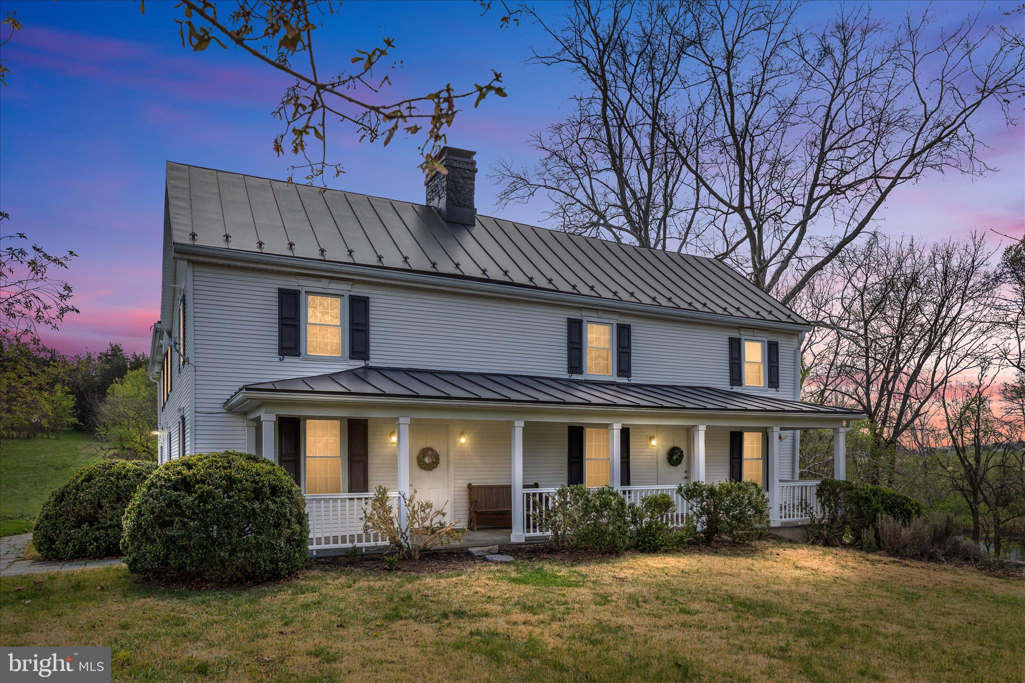 Nestled in the heart of the Shenandoah Valley, this truly one-of-a-kind property blends rich history, modern comfort, and breathtaking natural beauty—all set against the backdrop of sweeping mountain views and private access to the Shenandoah River. Originally built by Martin Kauffman, the meticulously restored two-story log cabin (2008) serves as the soul of this remarkable home.

Thoughtfully expanded and renovated, the residence offers 4 spacious upper-level bedrooms, each with its own ensuite full bathroom, creating a rare level of comfort and privacy for guests and family alike. A full bath on the main level adds convenience for everyday living and entertaining. The updated kitchen and dining area feature an open layout with French doors that lead to a stunning two-story deck overlooking the river—perfect for hosting gatherings or enjoying quiet mornings surrounded by nature.

The original log cabin living space is a true showpiece, complete with a two-sided stone fireplace crafted from materials sourced directly from the property’s own quarry, along with a built-in movie projector and large screen for unforgettable evenings at home. Outdoors, the property shines with a spacious lawn ideal for recreation, a patio with a charming open fireplace (once part of a historic smokehouse), and endless opportunities to relax, entertain, or explore.

Additional features include a partially accessible basement with both interior and exterior access, a machine shed with equipment storage, a separate kayak building with 8 kayaks that convey, and unique land elements such as a pond, an old quarry (source of bluestone used in the Blue Ridge Parkway), and the stone foundation of a former bank barn—offering potential for a future garden or outdoor entertaining space.

Major system updates include a 2008 renovation (plumbing, electrical, windows, siding, and more), new roof (2021), water treatment system (2022), well pump (2013), water line (2018), and newer appliances including a 2025 stove/cooktop.

Located just minutes from Shenandoah National Park, George Washington National Forest, Luray Caverns, and a wide array of outdoor recreation, dining, and local attractions, this property offers a lifestyle that is both peaceful and adventure-filled. Whether kayaking on the river, enjoying mountain sunsets, or gathering around the fire under star-filled skies, this home is a rare opportunity to own a piece of Virginia history in an unforgettable setting.