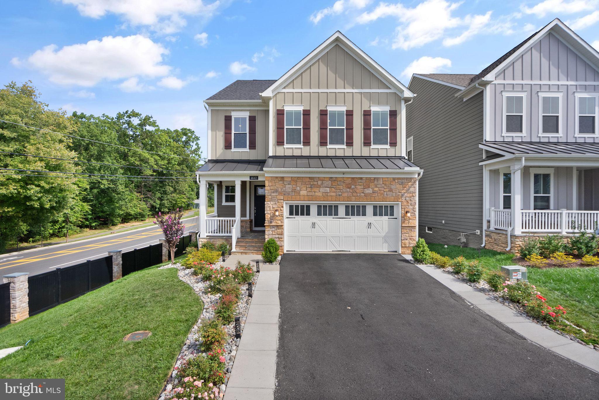 The luxuries of a modern home, completed at the end of 2022 by Pulte Homes, in the heart of Fairfax across from George Mason University and just outside Fairfax city limits near Old Town Fairfax. Welcome to this Wincrest model in the contemporary Mason Park community. This spacious single-family home has 5 bedrooms, 4.5 baths, a screened-in porch, and a fully fenced rear yard.  This home is situated on a non-through street with views of community green space, anchored around a large magnolia tree.  The home, with great curb appeal boasts a cozy covered front porch ‘for two’.  And, as you step through the front door, a spacious hallway leads you to a modern and open floor plan with high ceilings and natural light. The living room provides warmth and comfort with a designer fireplace and coffered ceiling.  The creative design is such that both the dining area and the gourmet kitchen are naturally defined, providing for a cozy and comfortable everyday living as well as ample room for entertaining family and friends! The kitchen has luxurious yet functional features with quartz countertops, stainless steel appliances, and a walk-in pantry. From the kitchen, you have easy access to a spacious 2-car garage through a built-in pocket office, perfect for an in-home workspace. The garage has additional space in the back and high ceilings for more storage capacity.  From the dining room is a screened in porch that provides access to the green, fully fenced backyard.  The top floor features a peaceful primary suite with 2 walk-in closets and a bathroom containing 2 separate vanities with storage, a large dual-head shower, and a soaking tub. This level is also home to a bedroom with an ensuite and walk-in closet, two additional bedrooms both with walk-in closets, a spacious hall bathroom with a double vanity, and a dedicated laundry room. The fully finished basement level is filled with amenities, including a large rec room, pre-wired for entertainment and surround sound; a wet bar, a guest room with a full bathroom, upgraded flooring, and walk-up access to the backyard. This partially buried basement is filled with tremendous natural light through four café windows and is a great flex space! Upgraded flooring, window treatments, 10' ceilings, and a whole-house water filtration system are just a few additional notable features to be found within the home. With great storage space, luxuriously appointed designs, over $75K of owner customizations, plus modern-day conveniences, this one is hard to beat.  A fantastic Fairfax County location: in the Woodson HS district, across the street from George Mason University, and only minutes to all the action and amenities that the City of Fairfax and Town of Vienna offer.  Don't miss the opportunity to make this house your home!