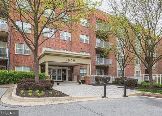 Beautiful open floor plan 4th floor condo in private and secure Condos at the Ridge, with dedicated garage parking spot. High location provides privacy and views from the home and its airy balcony. In the heart of Owings Mills but tucked away in its own protected world, this home with sparkling hardwood floors, magnificent gourmet kitchen  with breakfast bar that adjoins a spacious family room with gas fireplace defines comfort, convenience and style in 1370  square feet that feels even larger. Primary bedroom is bright and airy, quite spacious, and features direct access to the dazzling white bath and a huge walk-in closet. 2nd bedroom or den off the foyer provides privacy from the primary and is good sized itself.  A separate laundry room and a private balcony that overlooks the New Town Owings Mills landscape complete the pretty picture of what your life here could be.