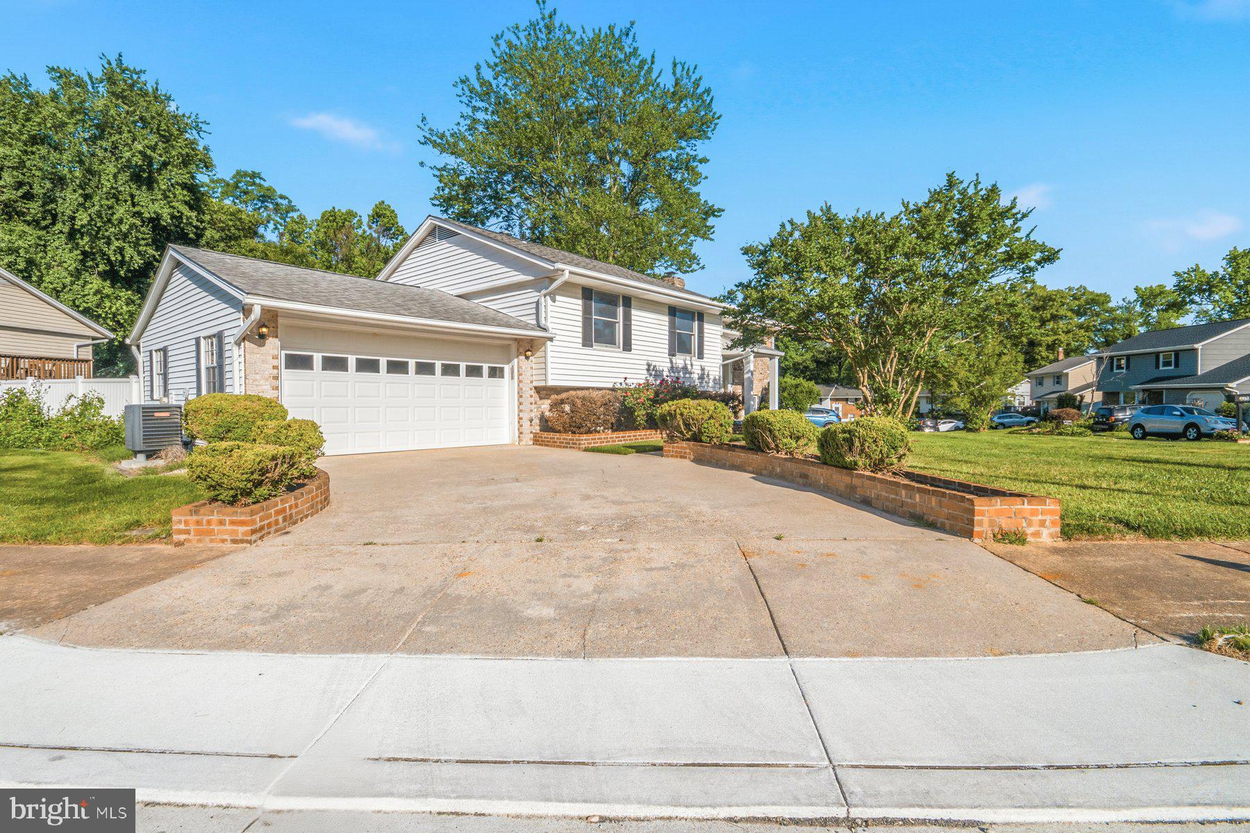 Welcome to 336 Regina Court in Millersville! Situated on a desirable corner lot adjacent to a quiet cul-de-sac, this well-maintained home offers exceptional outdoor living, abundant parking, and a private backyard oasis featuring an in-ground pool that's open and ready for summer fun. With two separate driveways, a two-car garage, and a thoughtfully designed split-foyer layout that maximizes every inch of living space, this home is built for both everyday comfort and effortless entertaining. The main level features hardwood flooring throughout the living areas and bedrooms, while the spacious kitchen offers ample cabinet and countertop space along with room for a breakfast table. The expansive lower level provides incredible flexibility with a large family room centered around a charming wood-burning stove and hearth, a separate recreation or flex room, a potential fourth bedroom, a second full bathroom with a walk-in shower, and a utility room with laundry hookups. Step outside from the lower-level walkout or access the elevated deck directly from the main level to enjoy seamless indoor-outdoor living. Whether you're hosting pool parties, summer cookouts, or simply relaxing in your own private retreat, this backyard is sure to impress. Freshly painted throughout with brand-new carpeting and numerous recent touch-ups, this move-in-ready home is ready for its next owners. Don't miss your opportunity to make 336 Regina Court your next home—schedule your showing today!