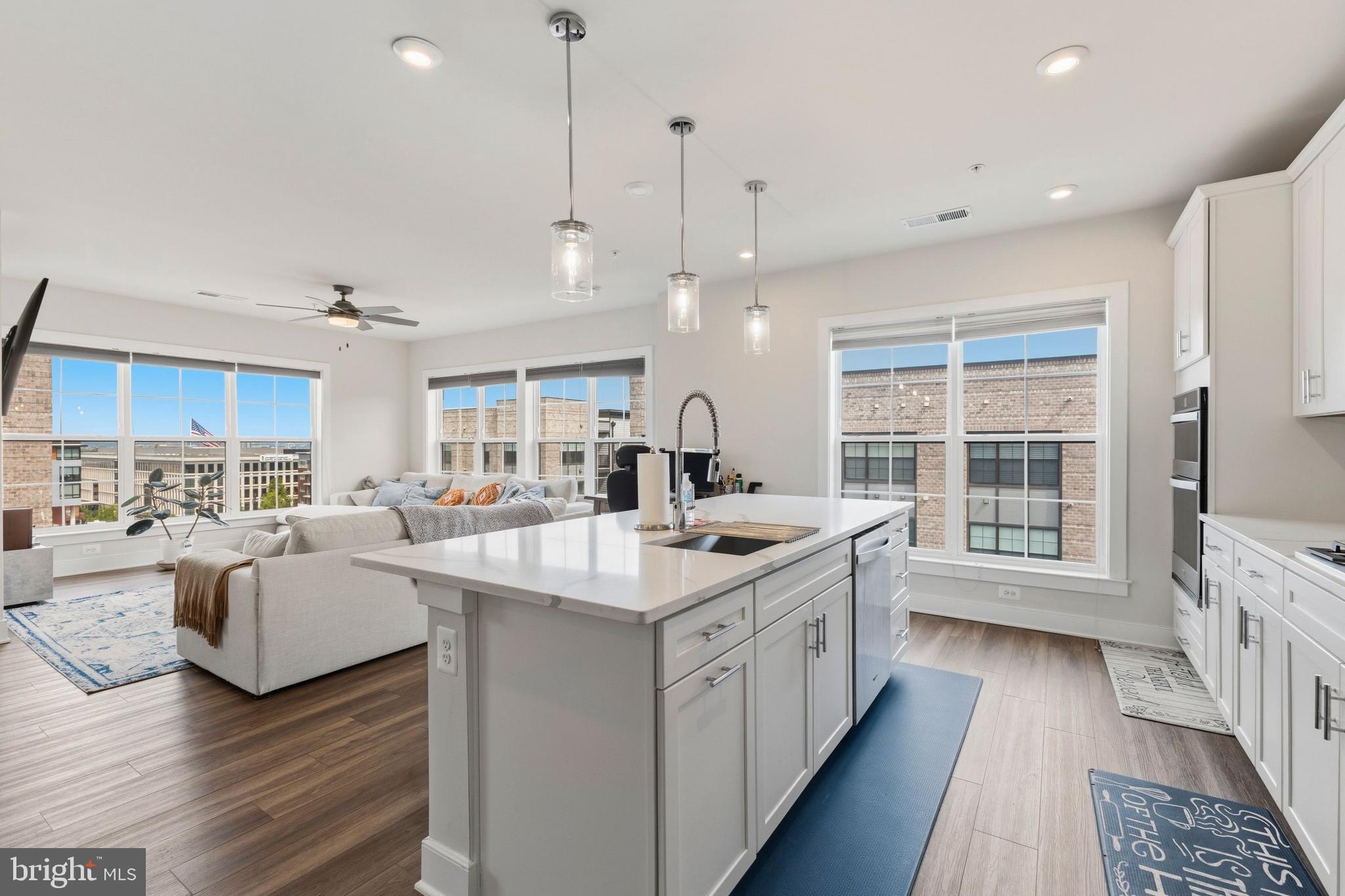 "SIGNIFICANT PRICE REDUCTION"  ASSUMABLE 5.75%  LOAN!!  Welcome to penthouse living at National Harbor! This stunning 4th-floor corner unit delivers the ultimate in luxury condominium living with breathtaking contemporary design in one of the DC Metro's most vibrant waterfront communities. Built in 2023 by Pulte Homes, this like-new 2 bedroom / 2 full bath residence offers 1,555 square feet of impeccably finished open-concept living space. The spacious living and dining areas flow seamlessly to a private balcony — perfect for entertaining or unwinding. The chef's kitchen features built-in microwave and generous counter space. The primary suite offers a luxurious 15x11 bath retreat. In-unit washer/dryer, tankless hot water heater, natural gas heat, and programmable thermostat add everyday convenience. Your 1 parking space (attached garage + covered garage) and access to EV charging are included. Enjoy the security of a gated community with all exterior maintenance, water, sewer, trash, and more covered in the condo fee. Steps to The Capital Wheel, world-class dining, entertainment, and waterfront recreation. Bus stop under 1 mile. Metro 1–3 miles. Natinal airport (DCA) under 10 miles. I-95/I-295 minutes away. Pets welcome — case by case basis. Seller concessions available. Quick settlement possible — 0 to 30 days. Don't miss this rare opportunity!