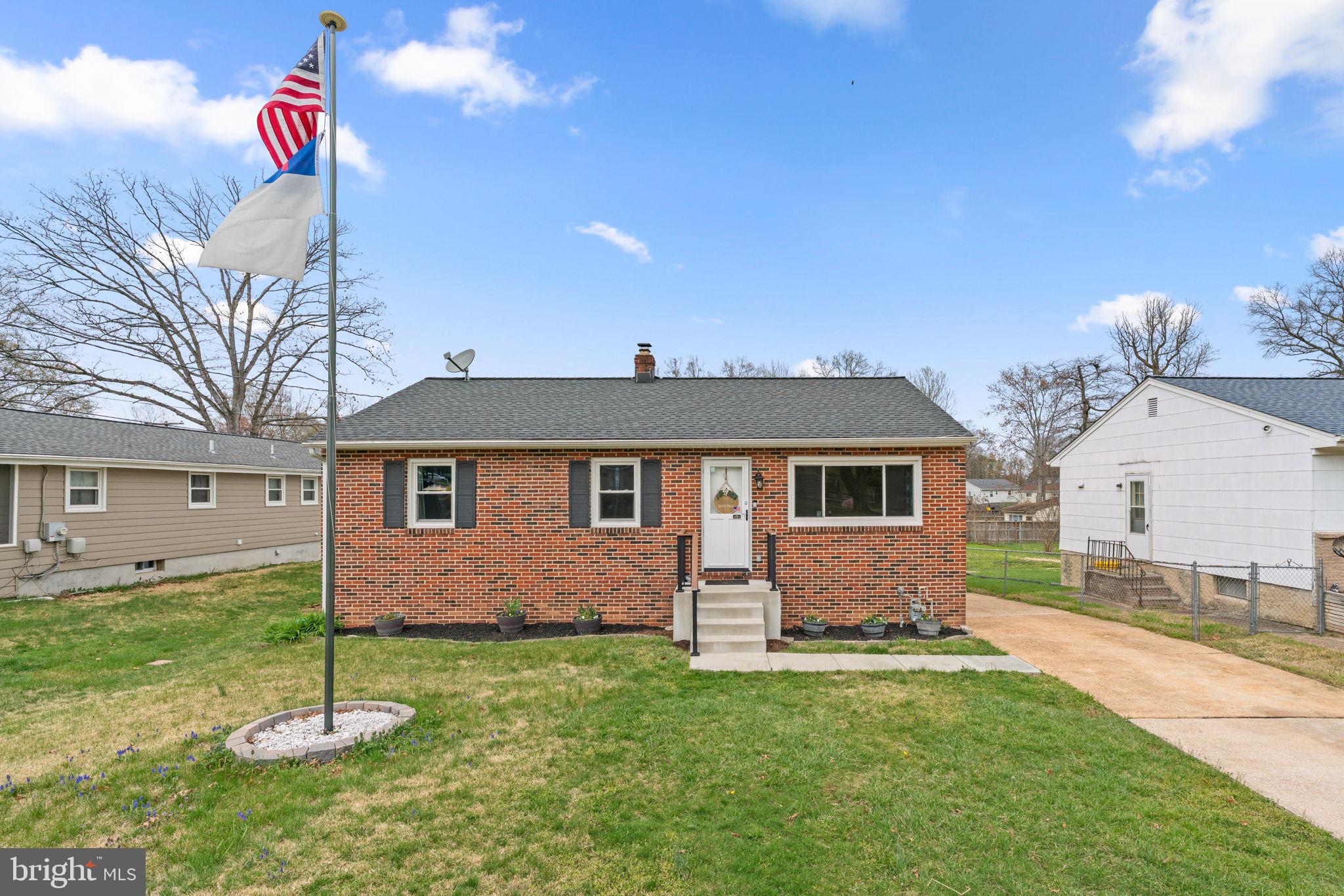 Charming brick-front raised rancher featuring 2,052 total square feet, 2 bedrooms, and 2 full baths in desirable East Glen Burnie. Light oak luxury vinyl plank flooring spans the traditional main level, beginning in the spacious living room filled with natural light. The formal dining room, complete with a ceiling fan for comfort, offers updated sliding door access to the deck and flows seamlessly into the kitchen. The kitchen boasts sleek black appliances, a white tile backsplash, ample cabinet storage, and generous countertop space. Two large bedrooms with newly installed carpet are located on the main level, including the primary bedroom with ample closet space. A full bathroom completes this level. The finished lower level offers two versatile bonus rooms—one with built-ins and another with a closet—alongside a cozy family room, a dedicated laundry room, and an updated full bathroom. Outdoor living is enhanced by a Trex® deck overlooking the fully fenced, flat backyard, which includes multiple storage sheds and a garden. Additional highlights include a high-efficiency HVAC system and a tankless water heater.