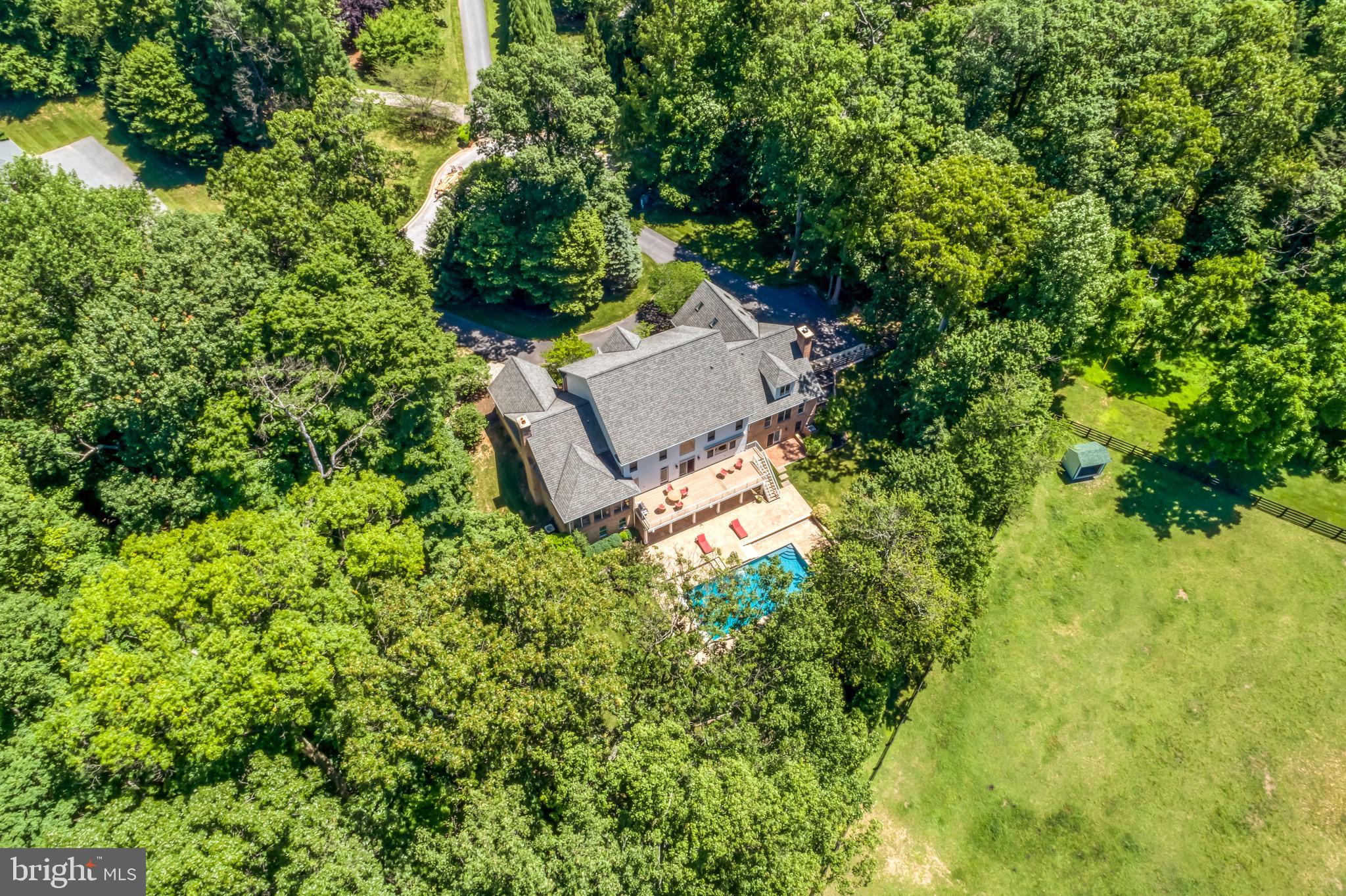 Remarkably refinished with the utmost style -- the perfect blend of solid architectural features with current design elements in a coveted location between the Caves and Greenspring Valleys.  Located in a small gated community of custom homes, this property is sited on a culdesac with privacy and a beautiful heated salt water pool.   Be wowed by the soaring ceilings and fresh surfaces -- the entire home has been thoughtfully updated  and designed with fresh paint, newly finished floors, remodeled kitchen, reconfigured design elements, and upscale lighting design by Jones Lighting.  Resort style feel in a well functioning home.  The recent renovations (2020-2021) are exactly what today's buyers are wishing for including multiple spaces for family to do work, play and relax.  Multiple bedrooms with ensuites on different floors offer privacy and places to get away.   Off of the pool is a light filled home gym and recreation room perfect for birthday parties, game watching and overnight guests.   Enjoy cold nights near one of the four fireplaces or take a peaceful morning swim in your heated pool...Relax your muscles in your own dry sauna, or cook a new recipe in the gourmet kitchen or gasfired grill overlooking the pool.  Feel confident in buying a house well maintained and beautifully updated -- this property is a 10 on a scale from 1-10.    Move right in and enjoy the luxury of enjoying every aspect of this wonderful home today.   A true gem in a super convenient location close to shopping, golf courses, public and independent schools just minutes away.