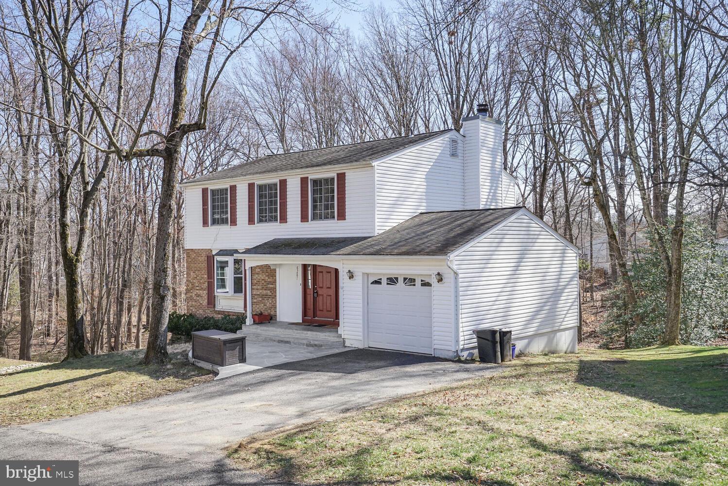 This Peaceful & Spacious Single Family Home is a Nature Lover's Dream. Dressy Stone Patio Entry. 3 finished levels with over 2600 sq ft, 4BR/2.55BA plus Office or Functional 5th BR. Beautiful Hardwood Floors main Level. Main Level Family Room w/Frpl just off the Kitchen and walks out to a large sunny deck with steps to the backyard. Quiet treed views. Walking trails throughout Newington Forest. 4 Generous Sized Bedrooms upstairs with New Carpet & generous closets. Renovated Hall Bath. Bright Walk Out Lower Level with Recessed Lights, Crown Moldings, Decorative Chair Rail and a bright Bonus Room.  Ideal as Home Office or Fitness Room. Washer/Dryer and a Laundry Chute from Kitchen rounds out this cozy Lower Level. There is an Extra Storage Room plus a 1 Car Attached Garage.  Homes sits on a cul de sac. Newington Forest HOA offers many amenities and with a low HOA fee! Wonderful Fairfax County Schools.  Easy access to Fairfax County Parkway, Southrun Road & I-95 & Lorton Town Center & VRE.  A friendly Community Clubhouse with Outdoor Pool, Tennis, Basketball & Many Walking Trails. Roof estimated 2015, HVAC 2018, HWH 2011. Gutter Guards to keep gutters clear.