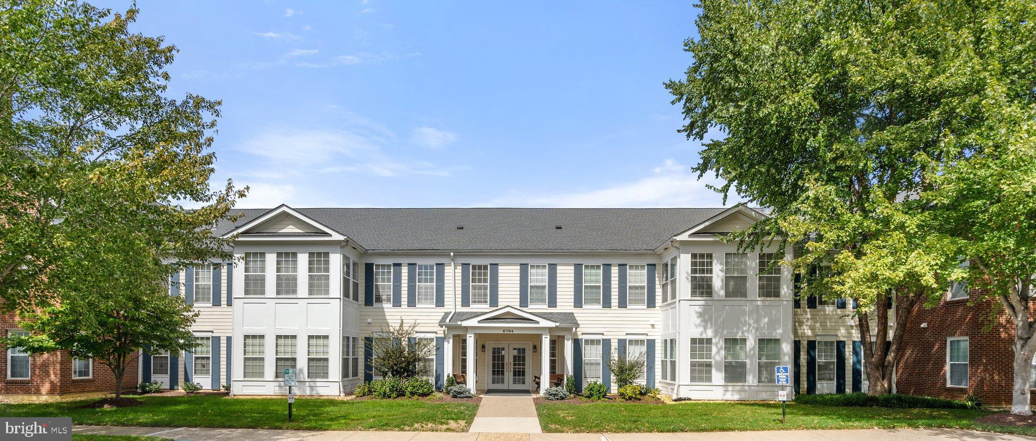 Welcome home! Light and bright describes this two bedroom, two full bath, corner, top floor condo flooded with sunlight from 20 scenic windows throughout.  Located in elegant, Suffield Meadows, this condo is one of the largest units in the building at almost 1800 square feet.  When you enter the condo through the inviting foyer you will immediately notice the expansive feeling as it leads you into the open concept living space with decorative electric fireplace (can be removed easily).  There is a separate den, eat-in kitchen, and a sunroom enhanced by walls of windows.  The master suite includes a large bedroom, oversized walk-in closet with helpful shelving, and a spacious master bath with a soaker tub and walk-in shower with new rain shower head, and double sinks.  The guest bedroom is positioned on the opposite side of the great room from the master suite, offering privacy for both.  The second full bath is conveniently located near the guest bedroom.  A linen closet a separate laundry/furnace room with a space saving washer/dryer which conveys, and oversized closet space throughout the unit complete the floor plan for your next home.
This 55+ community is located on the DC side of Warrenton.  At the entrance of the building, a security code allows access to the attractive main level common area lobby with fireplace and seating area, mailboxes and elevator.  A separate storage area is assigned and a deeded parking space is located in the basement garage.  Enjoy all the beauty the Suffield Meadows Community offers with paved walking trails throughout the surrounding meadows and mature landscaping.  An outdoor salt water pool, fitness center, clubhouse with library and ample visitor parking are additional amenities this community offers.  Easy living, convenient location, tranquility and sociability when desired are what you will enjoy; finding your safe haven for relaxation in the Northern Virginia environs.