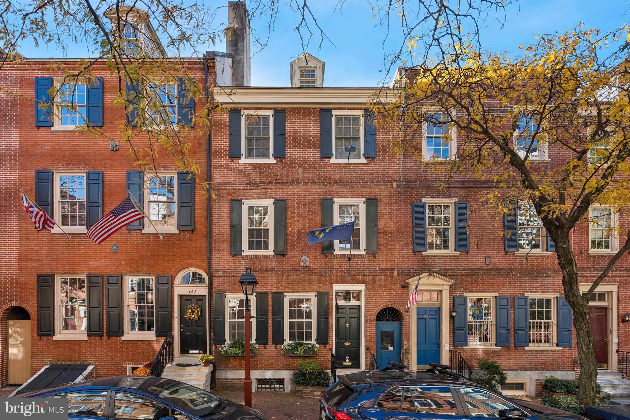 Welcome to 524 Delancey Street, where graceful federal architectural details punctuate throughout the home, promising an elegant backdrop for both entertaining and a serene personal retreat. This 1803 townhouse, nestled on a storybook block in Society Hill, showcases the preservation of it's historic foundation, enhanced for contemporary living. Enjoy four fireplaces both gas and wood burning, high ceilings, hardwood floors, and lush views from the kitchen into a rear brick garden with mature trees, lighting, and perennial plantings. The home has 4 bedrooms and 3 full baths with built in closets and bookcases for ample storage. The property features an impressive third-floor addition, completed in 2005, including large skylights that bring in an abundance of natural light to the home, and two generous sized bedrooms and a full bath. This well maintained house has a newly installed furnace (2024), hot water heater (2023), and the third-floor air conditioning (2017). Location is prime with wonderful schools in walking distance like the Blue Ribbon McCall School and St Peter's School, a few minute walk to Three Bears Park, Washington Square, Independence Park, historic sites, museums, and local food stores and shops. Easy access to I-676, I-95 and the airport for commuting as well.