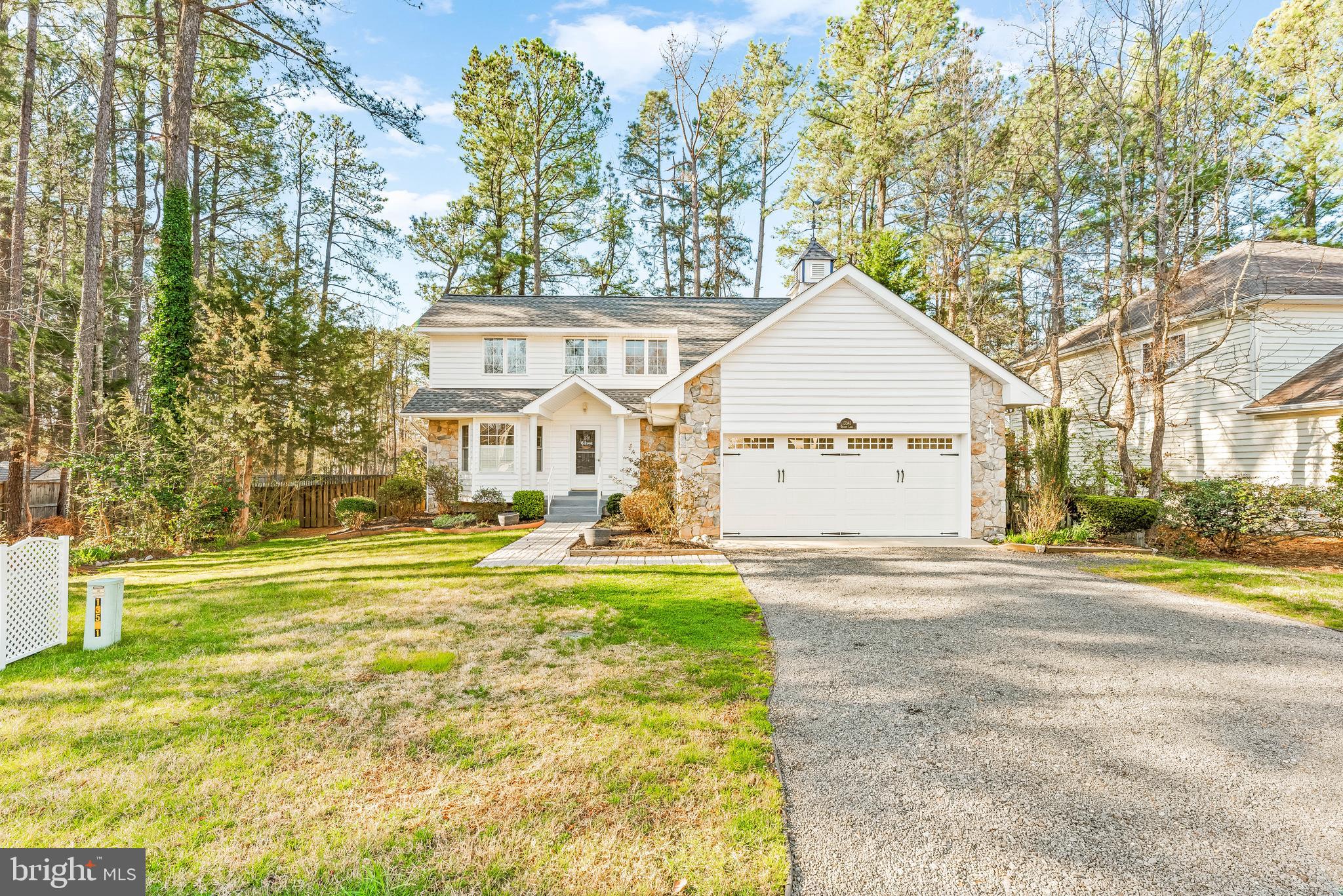IMMACULATE! Main Floor Owners Suite! This Charming 3 Bedroom 3.5 Bathroom Colonial w/ a Partially Finished Basement, a 2-Car Garage, and a Covered Deck that leads to a Fully Fenced in Back Yard is a SHOW STOPPER!! Driving up you are impressed immediately by the curb appeal w/ a bluestone driveway, fresh landscaping, stone front, & a nice walkway leading to the front stoop. Upon Entry you are greeted by gleaming hardwood floors and a split staircase w/ an open rail at the landing that gives a view into the Great Room that is surely the HEART of this Home! Left of the foyer is a well equipped kitchen that boasts upgraded stainless steel appliances, updated cabinet hardware, & large windows which allow in lots of natural light! Straight down the hall you enter into the Great Room which includes the Living & Dining Room Areas! Custom Trim wraps the entire space while decorative wood beams and a skylight impress you from the vaulted area above! The Living Room is home to a Gas Fireplace & a space already setup/pre-wired for your flat screen TV. The Dining Room is ample sized & provides access to both the kitchen & the Covered Rear Deck. Stepping Outside, the rear deck is the perfect space to entertain or just relax and read a book. The back yard is fully fenced with wood privacy fencing & provides just enough space for outdoor activities, yet requires minimal maintenance. Heading back inside, the right wing of the house just past the split staircase leads you to the garage, a nice half bath, the main floor laundry room w/ custom built-ins and lastly to the Main Floor PRIMARY SUITE! The primary suite is spacious enough for your choice of furnishings. Two closets, one of which is a walk-in equipped with built-ins, provides plenty of room for your wardrobe. The LUXURIOUS PRIMARY BATH is one of the best features of the home boasting tile flooring, a custom double sink vanity, and a unique tile shower with a rain head & handheld! Upstairs you will find 2 large bedrooms, both w/ custom wainscoting, one of which is equipped with 2 closets w/ built-ins. A full bath in the hall completes the upper level. The stairs the basement continue with custom trim that flows all the way into the rec room. Adjacent to the rec room is a storage closet & a full bathroom serving the lower level. Two door access a large unfinished area which could be additional finished space, a home gym or could be used for storage. This home is located in a small single culdesac water access community located in Solomons, MD within walking/biking distance to Solomons Island. Only a short walk to Anne Marie Gardens, the Solomons Town Center Park & you can easily take advantage of the new sidewalks & bike paths on Dowell Rd that lead all the way to Calvert Marina. Multiple Marina Locations with available slips could provide a home for your boat and/or all of your boating needs! This home is a GEM! Do NOT miss this opportunity! Open House Scheduled for Saturday, March 30th, 2024 from 11-2!