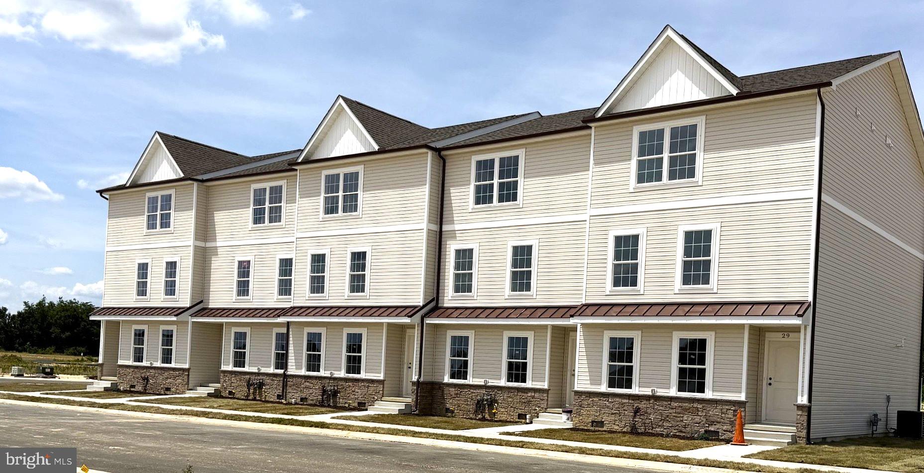 Don't miss your chance to own a brand-new home in this beautifully planned new neighborhood.   This sweet 3 bed 2.5 bath, 3 story townhome is situated in Harmill Village, a brand-new community.  Your new townhome is close to schools, the new Harrington Library, shopping and dining.  Easy access to Route 13.

This home includes UPGRADES such as solid surface countertops, upgraded stainless steel appliances and upgraded , soft close cabinets. Open floor plan with a 1 car garage, inside access to garage.  Don't miss out on the rare opportunity to own your dream home.   MOVE IN READY!