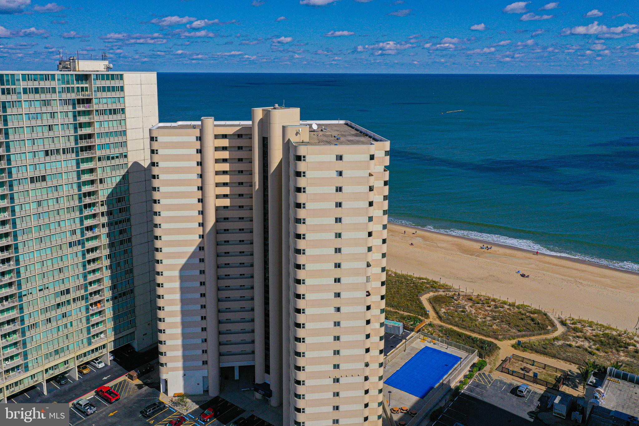 Looking for the perfect place at the BEACH?  This direct ocean front high-end custom design condo is just what you are looking for! Check out the spacious open floor plan. The kitchen is equipped with high-end stainless-steel appliances, including cooktop stove, dishwasher, refrigerator and convection oven microwave, custom tile backsplash and countertop. Displays a chic decor with added breakfast bar and washer/dryer for convenience.  Bathroom shower boasting elegant tile work, that enhances the easy access shower.   The Atlantis Condominium has Onsite Security, and a year-round maintenance team that contributes to the well managed building. Large well-maintained outdoor pool, equipped with bathrooms and showers for when you come off the beach, and a pet area! Excellent rental potential or enjoy it with your family and friends. Condo fees include flood and hazard insurance plus Direct TV streaming and WIFI!  So, what are you waiting for, come live the good life, you deserve!