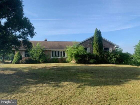 Upcoming Auction Thursday August 6th @ 6pm.
9.36 Acres w/ Brick Home, over 1,975 sq. ft. of living space; Kitchen, Dining Room, Family Room w/ Brick Fireplace; 3- Bedrooms, 2 Full Baths, Large Bay windows in Living & Family Rooms, Allows a nice view of the great outdoors; Full basement w/ ground level entrance; 2 Car garage, new shingle roof & windows in 2010;
Land is gently sloping w/ spring fed pond, & Laughlin Creek flowing through property, Several acres of wooded land with some mature timber that has timber value; This property is ideal for the outdoor lover; Property offers, hunting & fishing, or just a chance to walk outback & enjoy privacy; Home has heat pump & central air, Home could use some updates; Scenic Views, Sellers are motivated to sell, come prepared to buy.