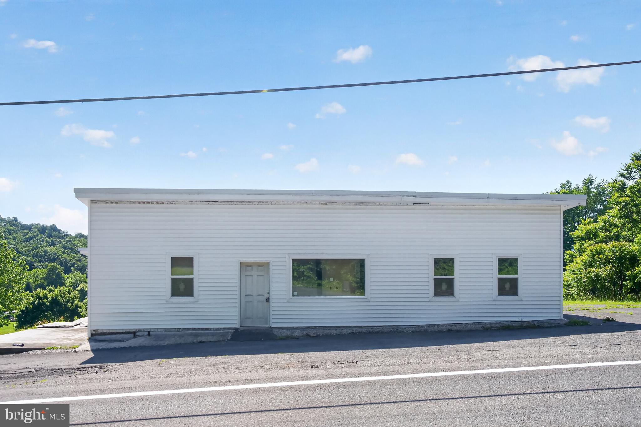 List Price is Opening Bid. Online Auction Only! Bidding begins Thursday July 9, and ends Tuesday, July 14, 2026 at 11:00 AM. Commercial property with residential potential featuring an 8,000± square foot building, based on previous Bright MLS listings, situated on a 0.6160± acre parcel with off-street parking. The property offers substantial space for a variety of commercial and residential applications. Zoned B-1 (Neighborhood Commercial) in Allegany County, this property presents numerous possibilities, subject to county approvals.

The building has been gutted and is currently studded with some drywall installed, providing a blank canvas for renovation, customization, or redevelopment. Additional features include a rear deck and a basement-level door with access to the backyard. The spacious interior provides flexibility for a wide range of uses, while the property's size and layout offer potential for owner-occupants or investors. Attractive views from multiple vantage points further enhance the property's appeal.

Permitted uses within the B-1 District include accessory dwelling units, home occupations, automobile parts and repair shops, neighborhood commercial uses, neighborhood convenience centers, conversion of residential structures to commercial uses, billboard signs, on-site signs, farm alcohol producers, banquet/assembly halls, and more.

Additional uses may be permitted by Special Exception, including car, truck, and other vehicle sales, duplex units, multifamily housing, condominiums, townhouses, mobile homes, and mixed-use developments.

Conveniently located in Allegany County, the property provides easy access to major commuter routes including Interstate 68 and U.S. Route 220. The surrounding area includes a mix of residential neighborhoods, local businesses, retail, and community services, supporting a variety of potential commercial and residential uses. Nearby outdoor recreation, parks, trails, and scenic mountain views enhance the setting, while downtown Cumberland offers shopping, dining, entertainment, and government services within a distance