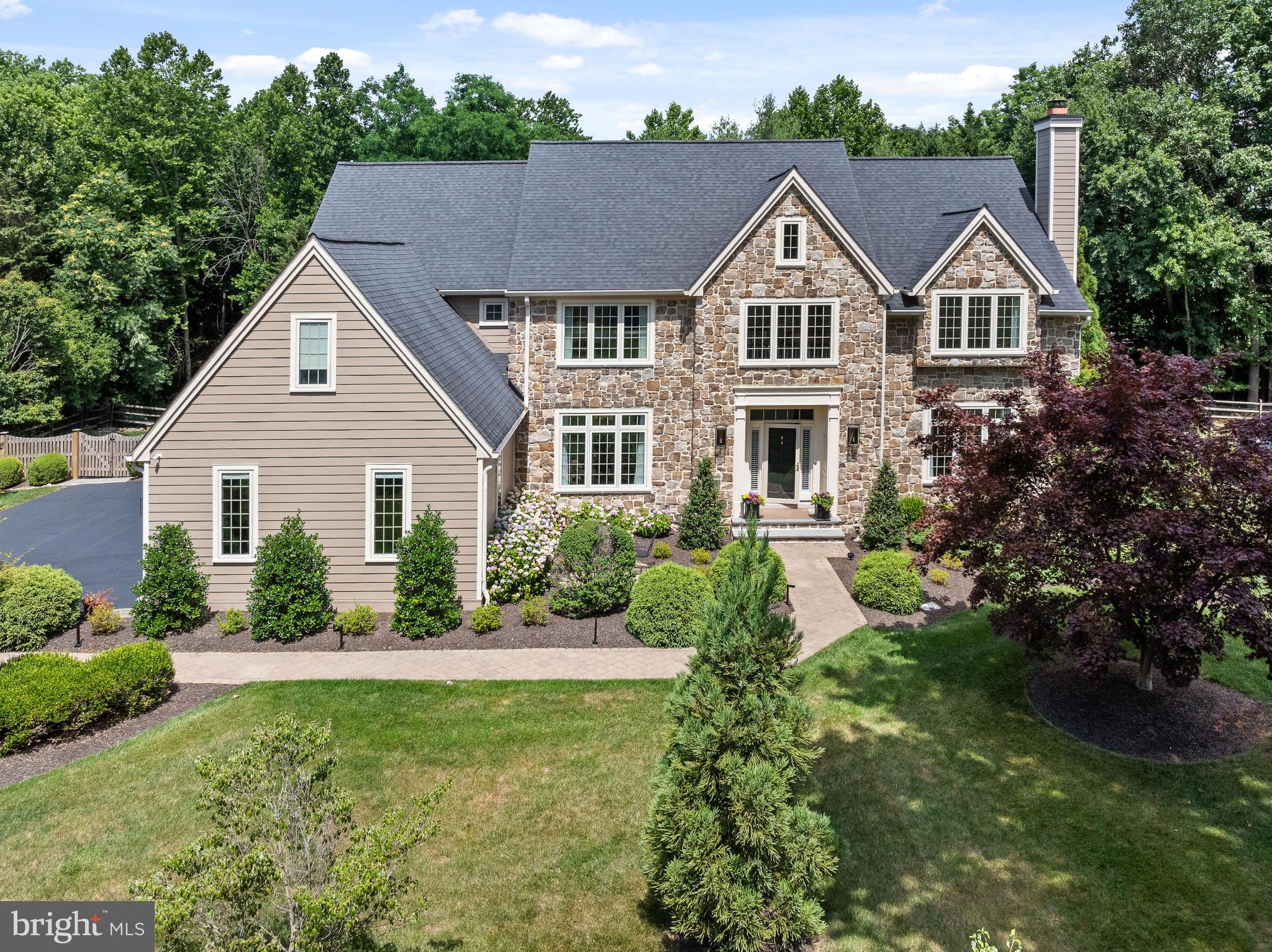 Nestled in the prestigious Treyburn community of Tredyffrin Township, the stunning property at 820 Dresher Way epitomizes luxury and sophistication, beautifully situated before the end of a quiet cul-de-sac. This location combines the benefits of serene, private living with the convenience of a close-knit community atmosphere. The home  itself, owned by the original owner since its construction, has been meticulously maintained, loved, and updated, reflecting a commitment to quality and comfort. Upon entering, guests are greeted by an impressive Foyer showcasing exceptional millwork, soaring ceilings, and a sweeping butterfly staircase, setting the stage for the home's refined aesthetic. The Foyer opens onto gleaming hardwood floors that continue throughout the First Floor, adding warmth and a seamless flow to the layout. The elaborate millwork and hardwood floors together create an air of distinguished craftsmanship and timeless beauty. Adjacent to the grand Foyer, the formal Living and Dining Rooms are the epitome of elegance, perfect for hosting gatherings with fine moldings and abundant natural light that enhances the ambiance. Also on the First Floor is a private Office, both functional and stylish, featuring handsome built-ins that provide ample storage and display options, ideal for a quiet study or conducting business. Just beyond the formal spaces, the home reveals its true centerpiece: a brand new gourmet Kitchen. This culinary haven is equipped with top-of-the-line appliances, custom cabinetry, and sleek quartzite countertops. Designed for both serious chefs and family gatherings, it opens seamlessly into a stunning two-story Family Room. This expansive area is notably enhanced by striking arched beams across the ceiling, adding architectural interest and a touch of  elegance. Large windows in the Family Room illuminate the space with natural light and offer captivating views of the lush backyard oasis. Conveniently located between the formal and informal living spaces, an elegant Powder Room adds a touch of sophistication and convenience, serving both guests and family members with style and accessibility. Additionally, the First Floor includes a Laundry Room and a Mudroom, which provides practical daily conveniences and easy access to the Three-Car Attached Garage. Upstairs, the Primary  Suite provides a luxurious retreat, complete with a spa-like marble  Bathroom, Sitting Room, and a spacious walk-in closet. Continuing on this floor, there are three additional Bedrooms, each freshly carpeted with new, plush carpeting that adds warmth and comfort underfoot. One of these is an en suite with a newly installed Bathroom, offering privacy and modern comforts. The other two Bedrooms are equally well-appointed and share access to a brand new, beautifully designed Hall Bathroom. The Lower Level of this home extends the living space with natural daylight enriching a versatile area that includes a movie viewing room and a convenient powder room, perfect for entertainment and relaxation. Outside, the property features a magnificent Pool and a charming Gazebo, making it a perfect setting for relaxation or entertainment. The meticulously designed Deck and Patio are  ideal for al fresco dining and enjoying the serene surroundings. With its combination of privacy, security, and accessibility to local amenities, 820 Dresher Road is an exceptional choice for those seeking a tranquil yet convenient lifestyle in a vibrant community. This home's enduring appeal is a testament to the loving care it has received throughout its history, making it a truly remarkable place to live. Don't miss this gem....showings begin WEDNESDAY JUNE 26th.