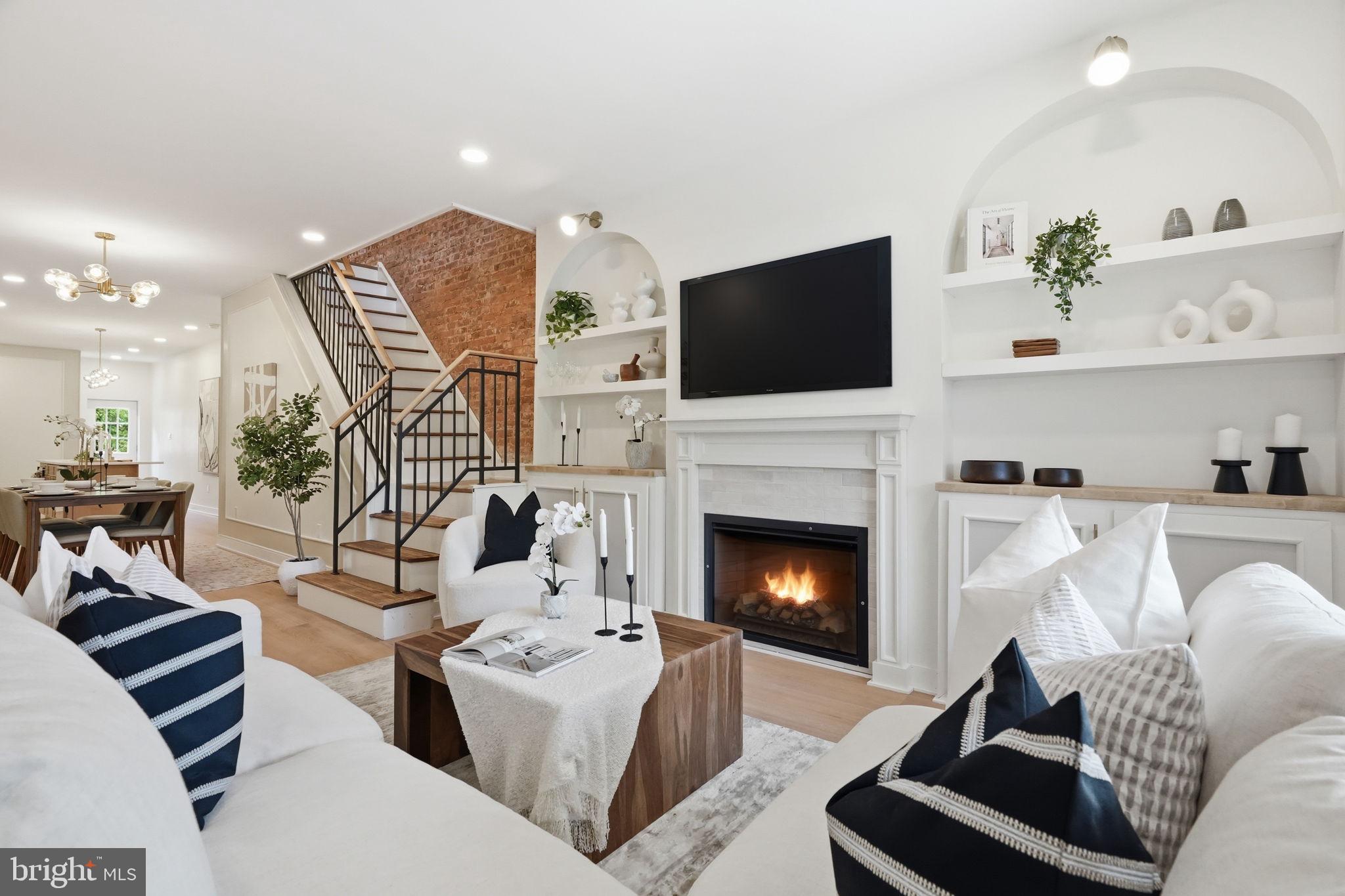 10-YEAR TAX ABATEMENT APPROVED STARTING IN 2026!. Welcome to 437 S. 50th Street, a stunningly reimagined luxury townhome on one of Garden Court's most picturesque tree-lined blocks, just one block from MALCOLM X Park. Fully renovated with all required City of Philadelphia BUILDING PERMITS, this exceptional home offers the confidence of a professionally completed renovation with thoughtfully updated major systems throughout. Located within the highly sought-after HENRY C LEA. School Catchment—one of only two University of Pennsylvania Partnership Schools in Philadelphia—and featuring an approved 10-year tax abatement beginning in 2026, this home delivers luxury living, long-term tax savings, and one of West Philadelphia's most desirable locations. Offering approximately 2,675 square feet, this beautifully designed home features 4 spacious bedrooms, 3.5 luxurious bathrooms, and a seamless blend of classic West Philadelphia character with sophisticated modern design. The inviting front porch welcomes you into a sun-filled open floor plan showcasing premium high-end flooring, designer recessed lighting, a statement dining chandelier, a stylish breakfast bar, and a preserved decorative fireplace with an electric insert and custom built-ins.The stunning two-tone gourmet kitchen features sleek cabinetry, upgraded countertops, premium Samsung Bespoke appliances, and exceptional workspace. Upstairs, the luxurious primary suite offers a spa-inspired bath with a double vanity and frameless glass walk-in shower, while three additional generously sized bedrooms provide flexibility for family or guests. The fully finished lower level adds valuable living space with a spacious family room, home office, gym, media room, or guest suite, complemented by an additional full bathroom. No expense was spared in this comprehensive renovation, featuring a new roof, 200-amp electrical service, all-new plumbing, HVAC system, energy-efficient windows, two-panel doors, premium Samsung Bespoke appliances, custom wrought-iron railings, and a private fenced backyard. The renovation was completed with all required City of Philadelphia permits and in compliance with applicable building codes. The property is also eligible for Conventional, FHA, and VA financing. Enjoy an unbeatable location just minutes from University City, the University of Pennsylvania, Penn Medicine, CHOP, Clark Park, Cedar Park, Malcolm X Park, Baltimore Avenue's restaurants and cafés, SEPTA Regional Rail, trolley lines, pickleball courts, and neighborhood favorites including Booker's Restaurant. With its generous size, fully permitted renovation, luxury finishes, sought-after Henry C. Lea School Catchment, approved 10-year tax abatement, and premier Garden Court location, 437 S. 50th Street represents one of the finest move-in-ready opportunities currently available in West Philadelphia.