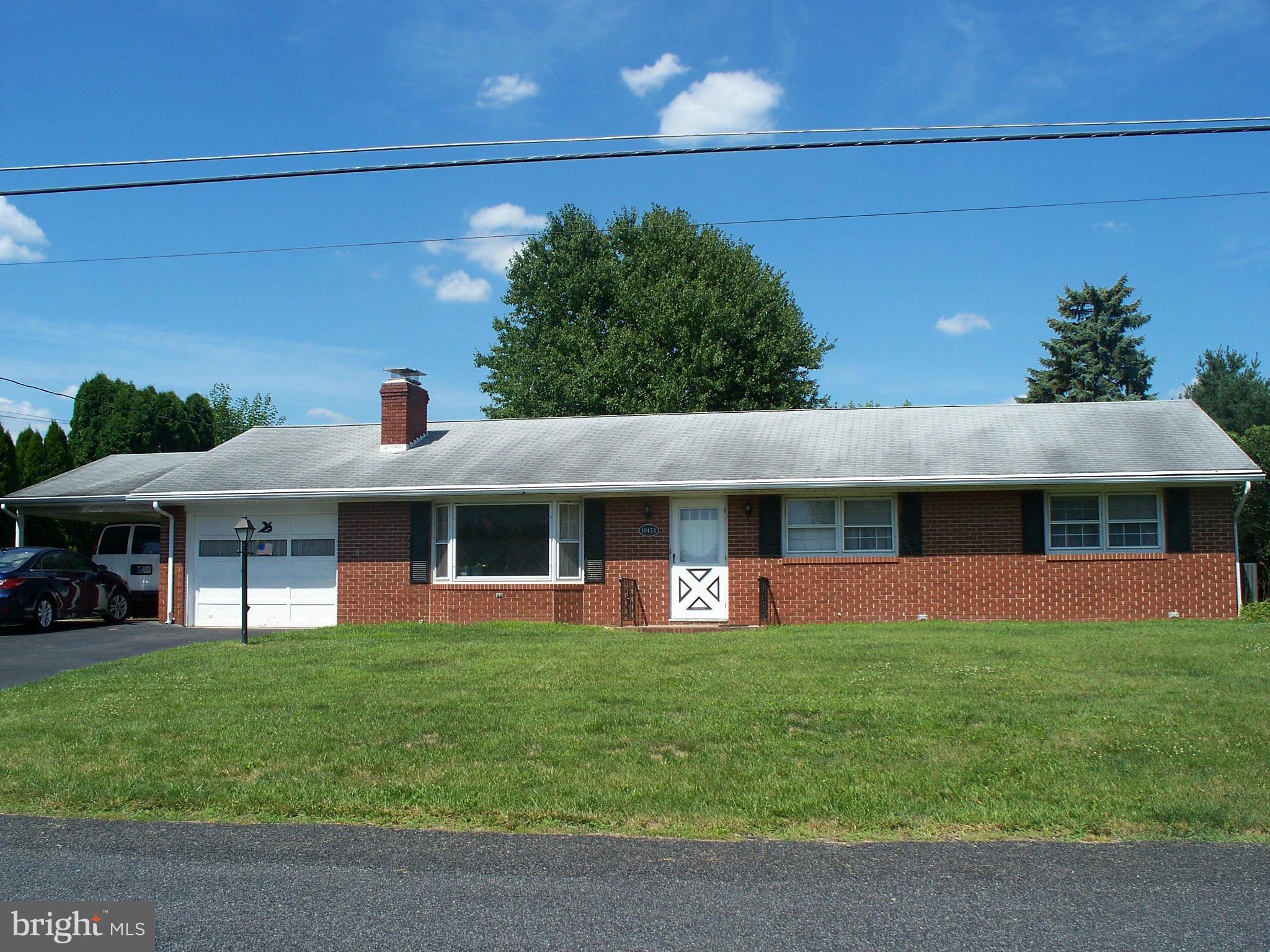 Spacious 4-bedroom rancher w/ new HVAC system & hot water heater. Walkable Wayne Heights neighborhood - no city taxes. Shopping nearby.  Foyer w/ slate to living room w/ fireplace & new carpet. New vinyl floor in kitchen w/ appliances. Sunroom looks out on level, secluded, tree-lined backyard w/ patio & shed. Attached garage & carport. Full basement w/ fireplace. Lighted closets. Move-in ready!