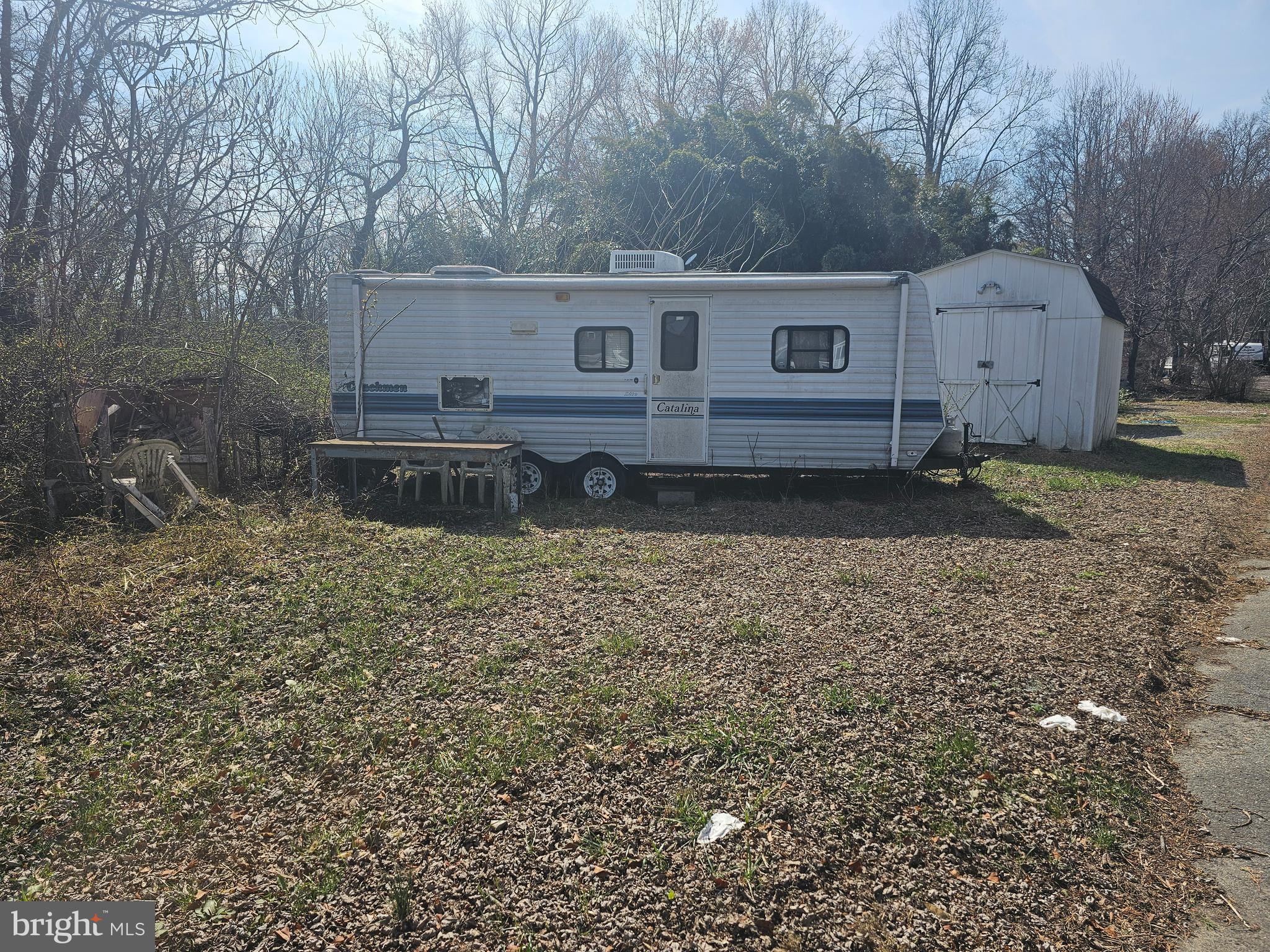 Two lots located in Indian Acres Campground (not a full time residence) with a camper and shed. Lots back to water.  So much to do in this Campground community with a boat ramp to the Sassafras/Chesapeake Bay, Pools, Convenience Store, Arcade, Activities and so much more. Come see what this gated community has to offer.