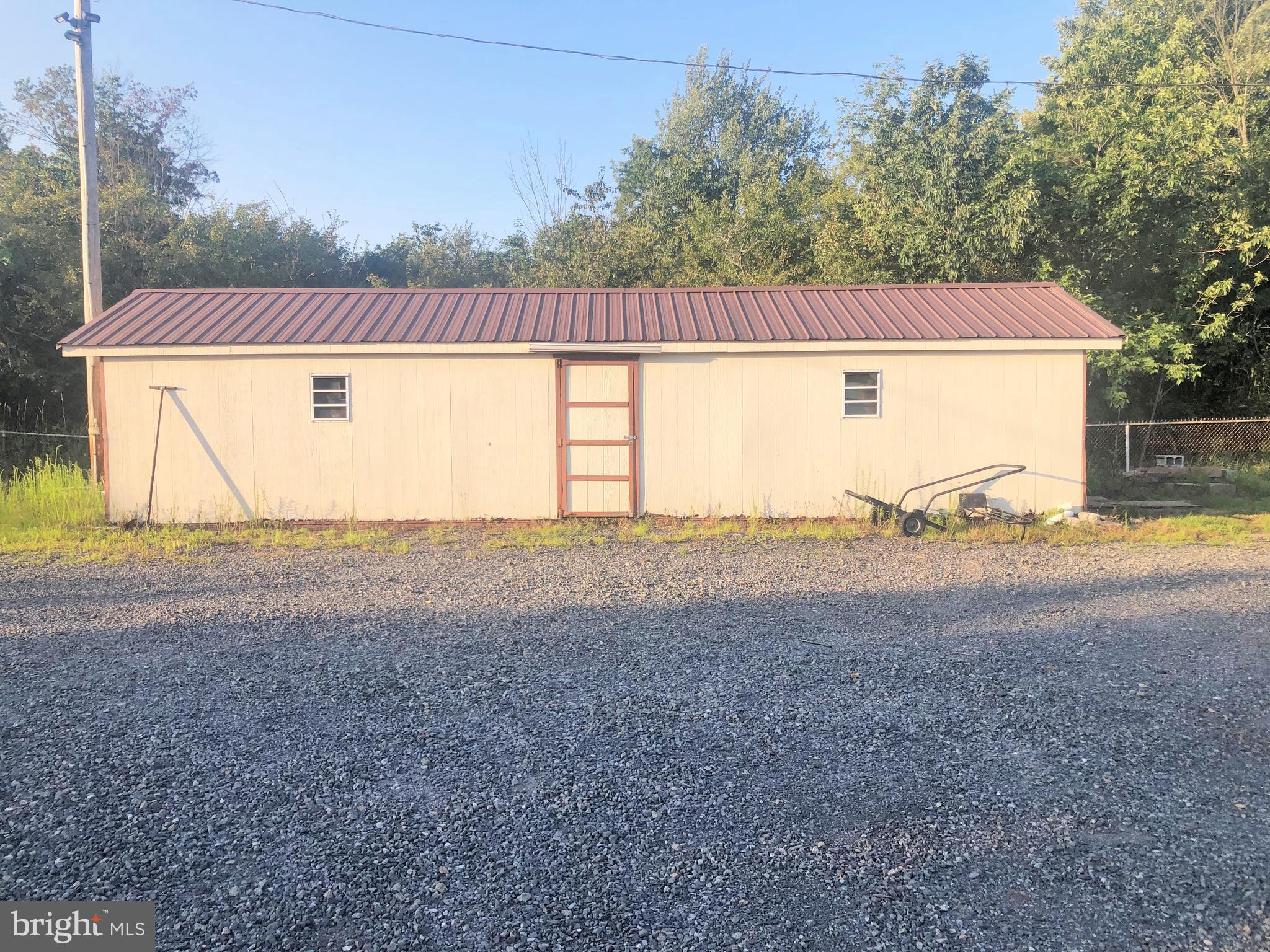 Fenced Storage yard great for a contractor, Has Electric & 2 sheds , Also Available for lease office space. The yard can be split in to 2 sections and can be leased out separately.  Right side of yard has 2 sheds, 1 Shed 13’ 6” X 40’ 2nd Shed is a Metal Trailer Box: 8’ x 33’ .