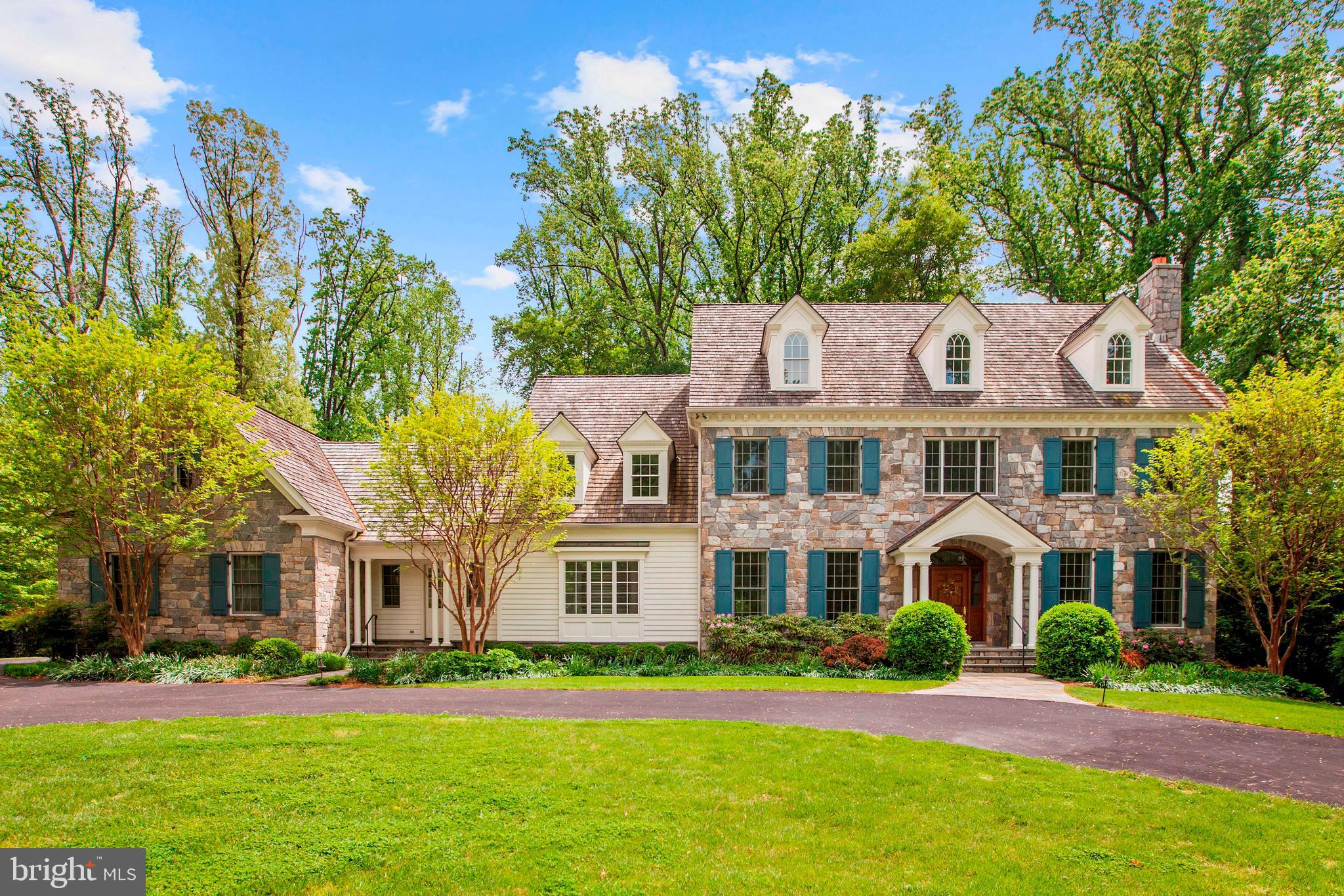 BREATHTAKING  7 BEDROOM  8 1/2 BATH  STONE CENTER HALL COLONIAL BEAUTIFULLY SITUATED ON A QUIET PEACEFUL STREET MINUTES TO POTOMAC VILLAGE.  THIS SPECTACULAR HOME HAS A WELL DESIGNED EXPANSIVE FLOORPLAN WITH APPROXIMATELY 11,000 SQ FT ON 4 BEAUTIFULLY FINISHED FLOORS.   FROM THE WIDE WELCOMING FOYER THROUGH STUNNING LIVING ROOM WITH FIREPLACE, GRACIOUS FORMAL DINING ROOM WITH  SERVING BAR,  EXPANSIVE FAMILY ROOM WITH FIREPLACE OPENING TO LUSH GROUNDS, HANDSOME LIBRARY WITH FIREPLACE AND BUILT-INS,  GOURMET KITCHEN WITH 2 SINKS AND ALL DESIGNER APPLIANCES,  BREAKFAST ROOM WITH A WALL OF WINDOWS SHOWCASING BEAUTIFUL VIEWS OF PRIVATE GROUNDS,   PRIVATE GUEST BEDROOM WITH BATH.   UPSTAIRS  THE  EXPANSIVE MASTER BEDROOM HAS A FIREPLACE, LARGE MASTER BATH,  SEVERAL WALK IN CLOSETS AND A SITTING ROOM PERFECT FOR RELAXING OR  HOME OFFICE.  3 ADDITIONAL FAMILY BEDROOMS EACH WITH BATH ALSO ON THE SECOND FLOOR ALONG WITH A DELIGHTFUL SITTING ROOM NEXT TO A FULLY EQUIPPED LAUNDRY.  THE THIRD FLOOR HAS A BEDROOM WITH SITTING ROOM AND FULL BATH.   LOWER LEVEL IS A NICE OASIS WITH GREAT SPACE AND LIGHT.  GORGEOUS 2ND FAMILY ROOM WITH FIREPLACE,  LARGE MEDIA ROOM,  BEDROOM WITH FULL BATH,  GYM WITH BATH.  AND LARGE STORAGE ROOMS.  THE FLOORPLAN OFFERS VERY LIVEABLE, COMFORTABLE LIVING SPACES WITH SOMETHING FOR EVERYONE.   OUTSIDE IS A 3-CAR GARAGE AND LUSH LANDSCAPED GROUNDS.  ALL ONLY MINUTES TO POTOMAC VILLAGE WITH SHOPPING AND MANY AMENITIES EASILY AVAILABLE!!!  TRULY A SPECIAL OPPORTUNITY.