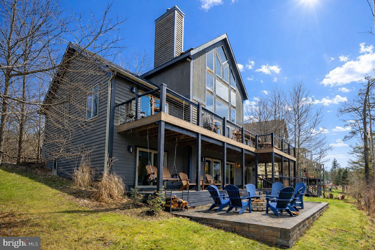 If you're in the market for location, convenience, and rental income,  this inviting 6 Bedroom 4.5 bath Lakefront home is calling for you!  Located in the heart of the action on Deep Creek Lake, the 3 level chateau has been updated and upgraded  both inside and out.   Restaurants, the movie theatre, shopping and Deep Creek Lake State Park are all within walking distance.  

Offering an open layout with abundant glass, there is plenty of natural lighting throughout the floor plan.  Two primary suites with cathedral ceilings and private baths along with 4 bedrooms offering direct bath access allows comfortable sleeping for 12 plus.    The large great room with fireplace and cathedral ceiling  features a beautiful wall of windows overlooking the lake.  The adjoining kitchen and dining areas provide additional space for gatherings and meals.   On the lower level, a family/game room with fireplace includes a second refrigerator and direct lower deck access.  

The newer two level decking system offers unobstructed views and direct hot tub and fire pit access.  Great lake views are available from both levels providing beautiful sunrises and evening shade.  

For those looking for rental income, this property known as Stone Crest knocks it out of the park, averaging over $105,000 in annual gross rental income over the past 3 years.