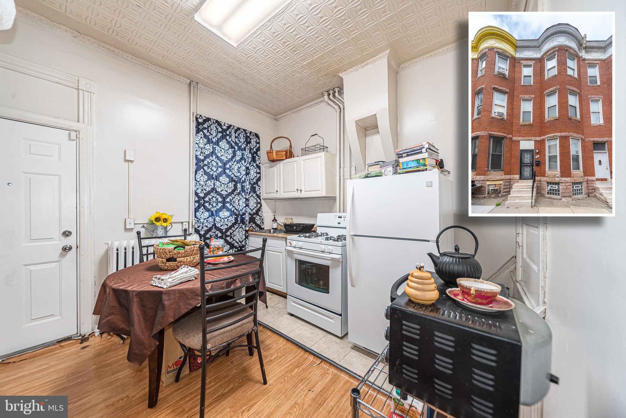 EXPANSIVE 4 LEVEL ROWHOME LOCATED DIRECTLY ACROSS FROM BON SECOURS HOSPITAL!  Main level features a living room, separate dining room (currently being used as a bedroom), full kitchen, and a half bath.  The 2nd level has 3 bedrooms and 1 full bath and the 3rd level offers 2 additional bedrooms and another full bath.  The full basement has ample storage space, laundry, and a 3rd full bath.  Property is perfectly set up for a single family residence, a boarding house, or even has the potential to be converted to a multi-family property.  Endless Possibilities!  Sold As-Is!