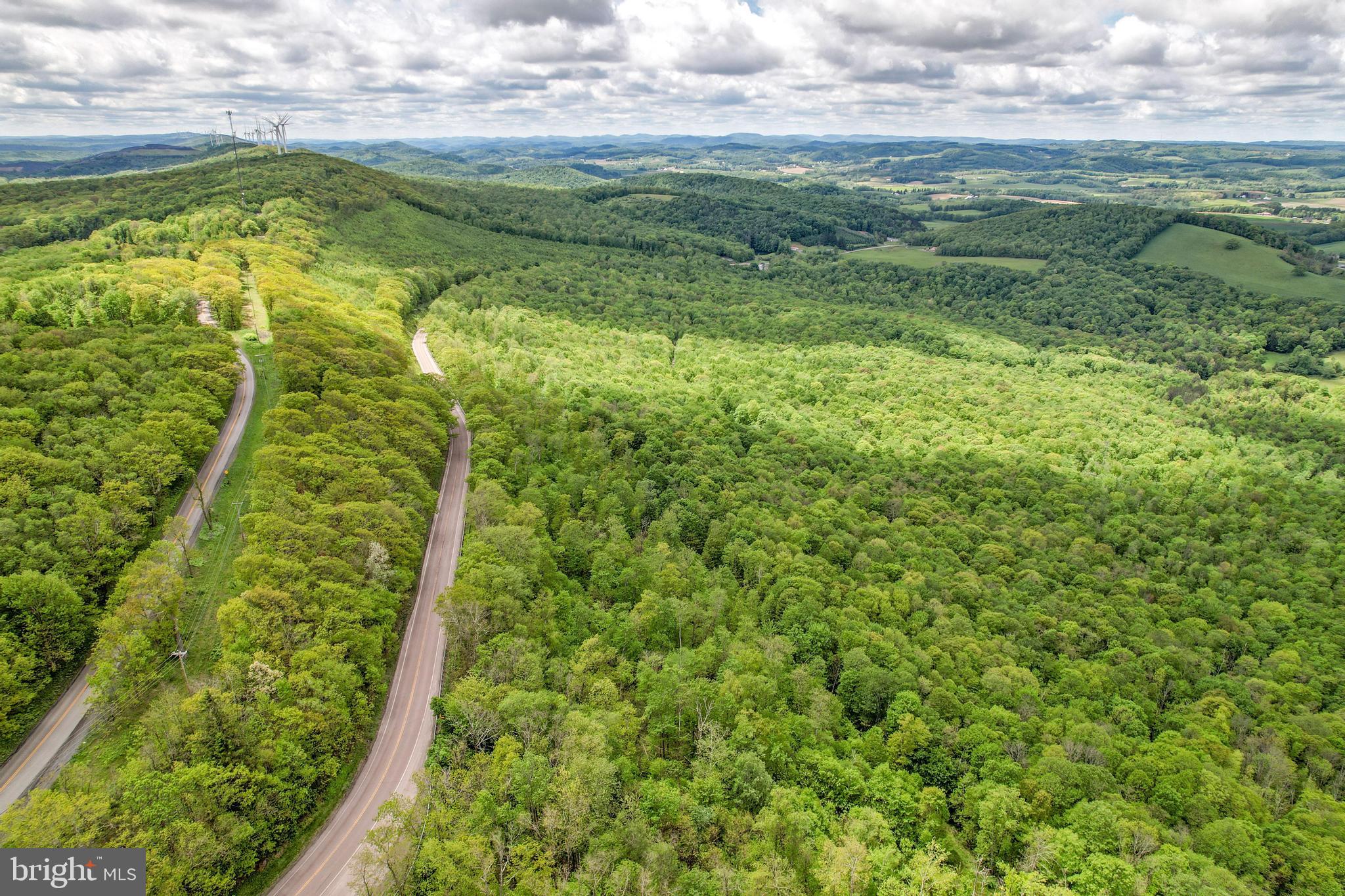 Discover the potential of this expansive 100+/- acre property ideally located with nearly 1.5 miles of combined road frontage along George Washington Highway and Table Rock Road in Garrett County, Maryland. The property is currently divided into five separate parcels, creating a variety of possibilities for future development, investment, or long-term land ownership. The layout provides flexibility for those considering residential development, recreational use, or holding the land as a long-term asset in a desirable area.


Three of the parcels have access to public water, which can simplify future development planning and increase the property's overall utility. In addition, two of the parcels have previously passed conventional perc testing. The remaining three parcels are suited for sand mound systems that would require a BAT system, providing additional options for residential construction with proper planning and approvals.


The land features a mix of open and wooded areas with gently rolling terrain that could accommodate a variety of uses. The extensive road frontage provides multiple potential access points and allows for flexible subdivision or development layouts. The size and configuration of the parcels may appeal to builders, developers, or buyers looking for a large tract of land with multiple future opportunities.


Conveniently located approximately 20 miles from Deep Creek Lake, this property offers close proximity to one of the region's most popular recreational destinations while still maintaining a rural setting. Outdoor recreation, state parks, and mountain scenery are all nearby, making this a location that attracts both full-time residents and seasonal visitors. Whether you envision a residential community, recreational facility, or potentially a commercial venture, this land provides a blank canvas to bring your vision to life. Don’t miss out on this rare opportunity to invest in a prime piece of property within Garrett County with great potential. Contact Land Specialist Taylor Nitterhouse today to schedule your private showing.