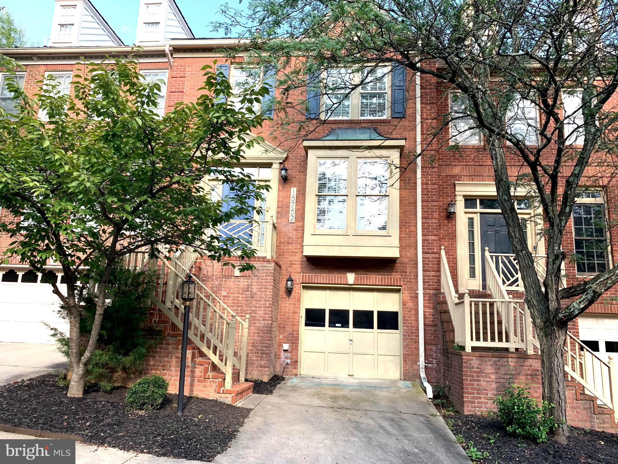 Beautiful brick front townhouse with spacious, bright and sunny kitchen. New kitchen Cooktop on order.  PRICE REDUCED.  NEW COOK TOP INSTALLED. Large open dining room and living room with 9 foot ceiling.  Enjoy spacious and sunny  table space kitchen. Ample size bedrooms, Jacuzzi bath, Large Deck and patio for entertaining. Three level living areas with a bathroom on all levels. One car garage. Enjoy walk-out lower level recreation room with full bath.  Also, there are several available outdoor parking spaces across from the unit. Convenient to shopping and major transportation arteries. Landlord is requesting a minimum 720 credit score and minimum $120,000 annual income. Convenient to shopping and major roadways.