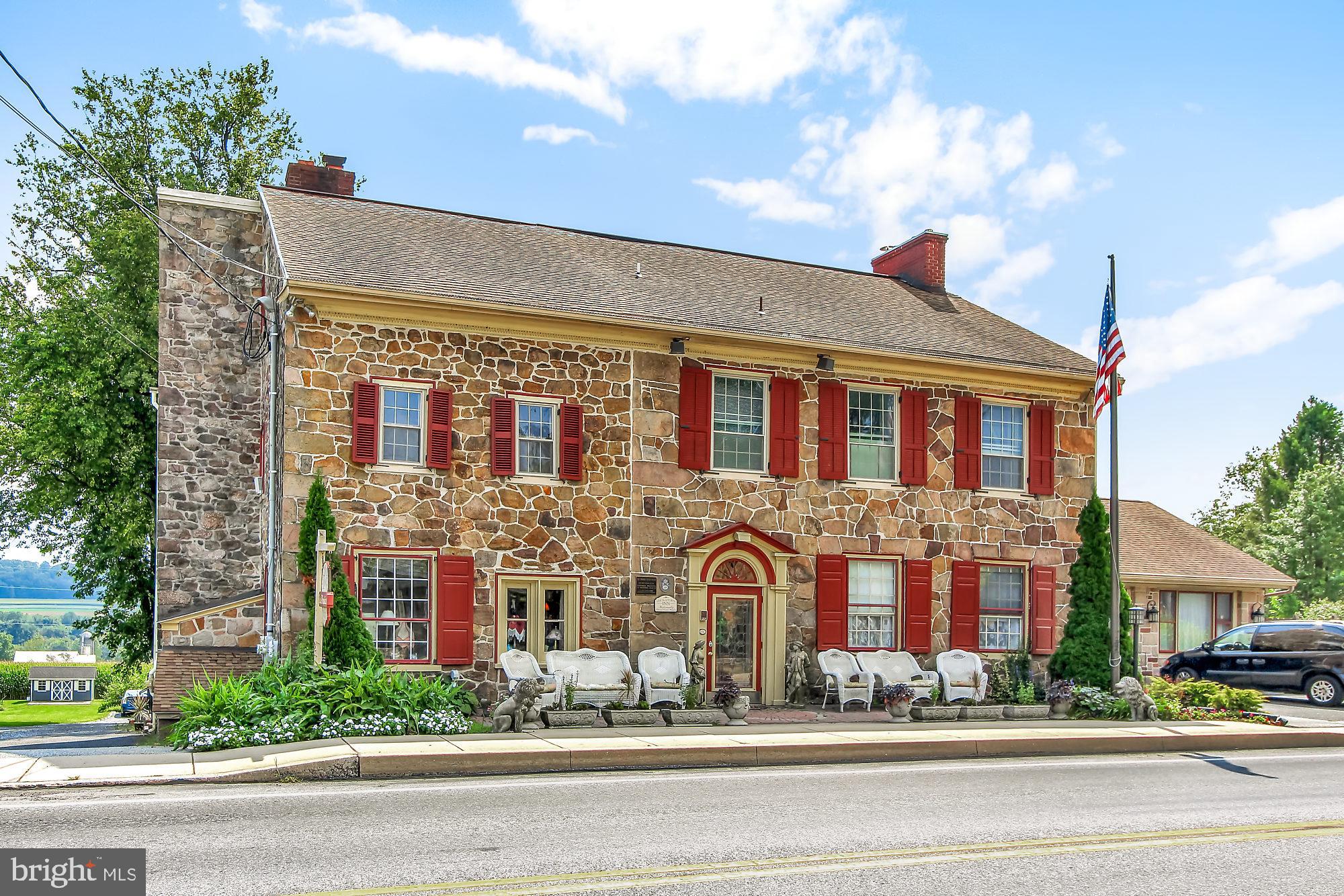 This beautiful sandstone home is on the National Register of Historic Places in the picturesque Village of Churchtown.  Known as The Hon. Edward Davies House, who purchased this property in 1804.  Edward Davies was elected to the State Legislature in 1834, and served in the Twenty-fifth and Twenty-sixth Congresses from 1839-1841.  This home is an excellent example of the early Federal period of architecture in eastern Lancaster County. It features spacious formal rooms on the main floor, with bedrooms on the second and third floor.   All bedrooms include an en suite bathroom.  There are three gas fireplaces throughout the home with original mantels.  There is tremendous flexibility with the floor plan for those looking for space to work from home. Come tour this exceptional historical property to see for yourself!