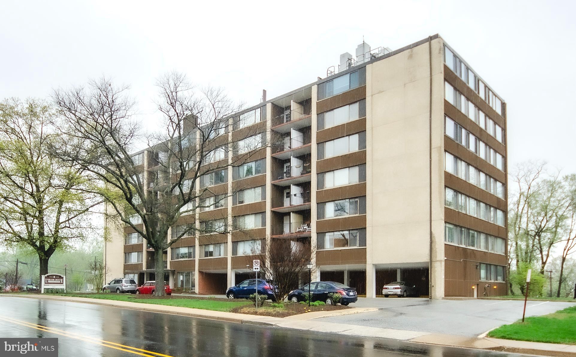 This tastefully updated, exceptionally spacious condo with a mid-century modern aesthetic offers 1,025 sq ft of updated, open concept living space. The well laid out corner unit floor plan offers a foyer entry with coat closet, handy office area, sweeping living room and a separate dining area, all highlighted by handsome updated flooring and oversized windows. The stylishly renovated kitchen boasts stainless steel appliances, Carrera marble countertops, and crisp white cabinetry, while the generously sized bedrooms offer relaxing new carpeting and ample natural light. The updated ceramic bath and tasteful paint finishes add to the condo’s appeal. Step outside onto the private covered balcony—an ideal spot for enjoying morning coffee, dining al fresco, or container gardening. Additional conveniences include reserved covered parking right outside the door (space #22), a supplemental storage unit (#27), package room, building party room, lovely renovated lobby with modern pass code door entry and on-site laundry facilities. Monthly condo fee covers all utilities (electricity, gas, water, sewer, refuse & recycling) along with building amenities. Conveniently located, this home is just half a block from the charming Lee Heights shops and cafes, with Metrobus access right outside the front door. Plus, you're just over a mile from the vibrant Ballston Quarter and the Orange Line Metro corridor, providing easy access to dining, shopping, Metrorail and entertainment.