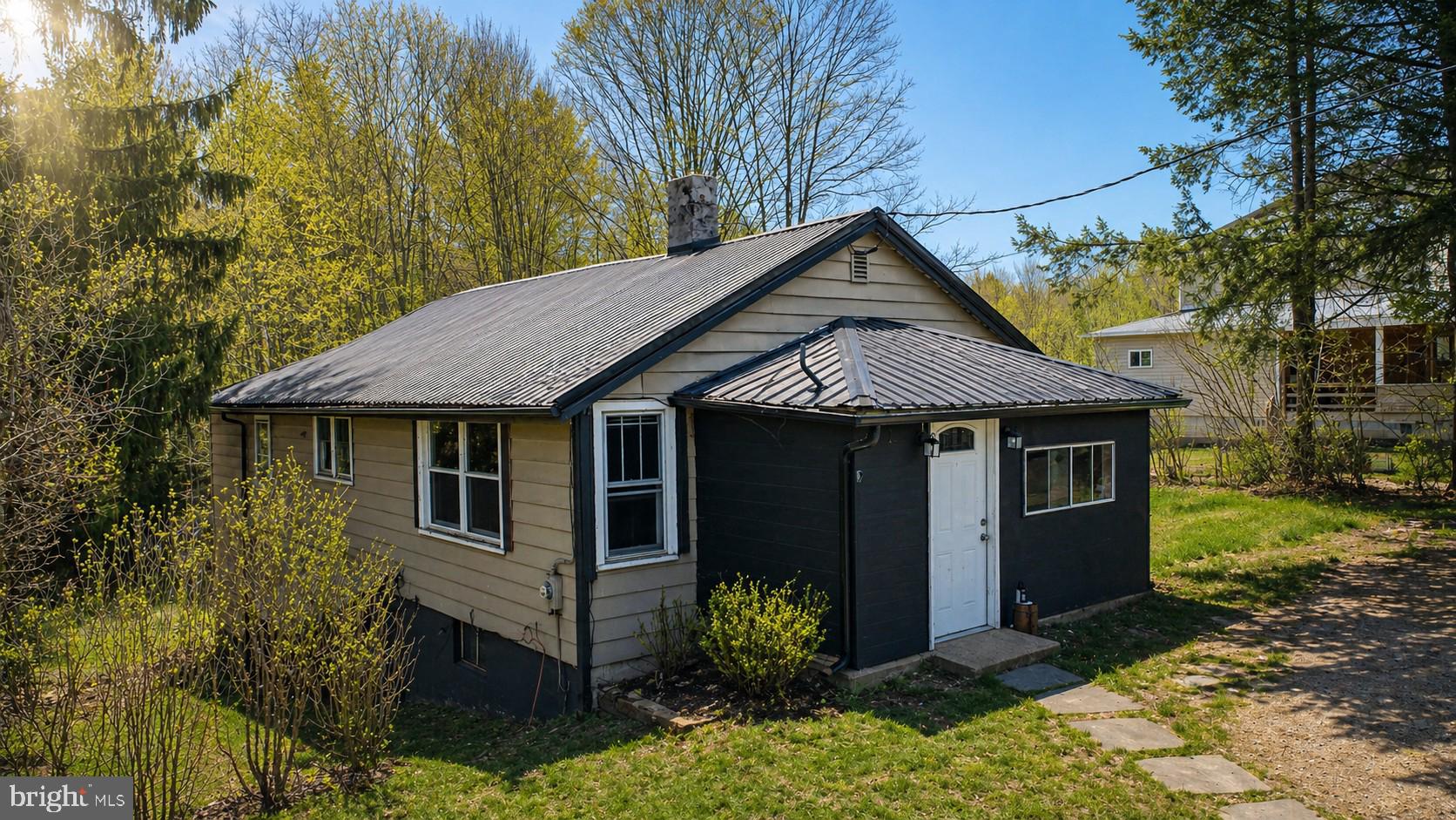 Charming 2-bedroom, 1-bath home offering a fantastic opportunity for buyers looking to add their own personal touch. Recent updates include a metal roof, 2 propane wall unit heaters, and a hot water heater. Enjoy the back covered deck overlooking the woods and the youghiogheny river below. This property needs a bit of TLC but is full of potential and character. Located in a highly desirable school district, the home is just minutes from everything Oakland has to offer—shopping, dining, recreation, and local amenities. Whether you’re a first-time buyer, investor, or someone seeking a renovation project, this home provides a solid foundation in a great location. Contact today to schedule your own private tour! Summer photos have been digitally enhanced using AI.
