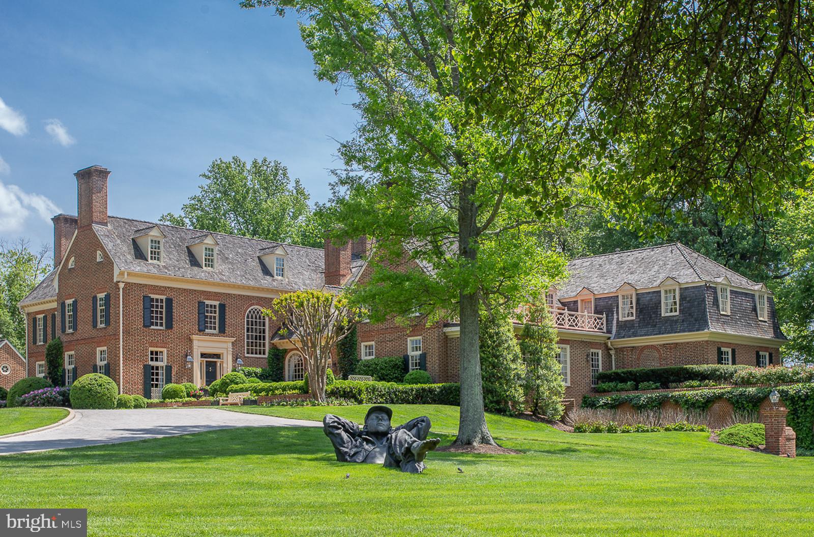A unique offering of a magnificent, gated estate on SIX acres in the exclusive Round Hill Neighborhood. The all brick, main house features four finished levels, with seven en suite bedrooms. The lower level is a car lover's dream, with a side garage entrance to showcase your prize possessions! The pool house, featuring a kitchenette and full bath, sits on an impeccably landscaped two acre lot alongside the main home.  Walk down to the second two acre parcel that offers a two bedroom guest home and lighted tennis court.  The third two acre parcel is a lush green, flat and cleared piece of land that is buildable and already has septic approved by the county.  Or the new owner can entertain horses, or keep the land as is  and enjoy the beautiful view!  Great value in this six acre property with three separate structures!
**THIS SALE INCLUDES LOT 87, 89 AND P86.   TAX INFO LISTED FOR THIS PROPERTY ONLY DISPLAYS INFO FOR LOT 87 (MAIN  HOUSE/POOL HOUSE).