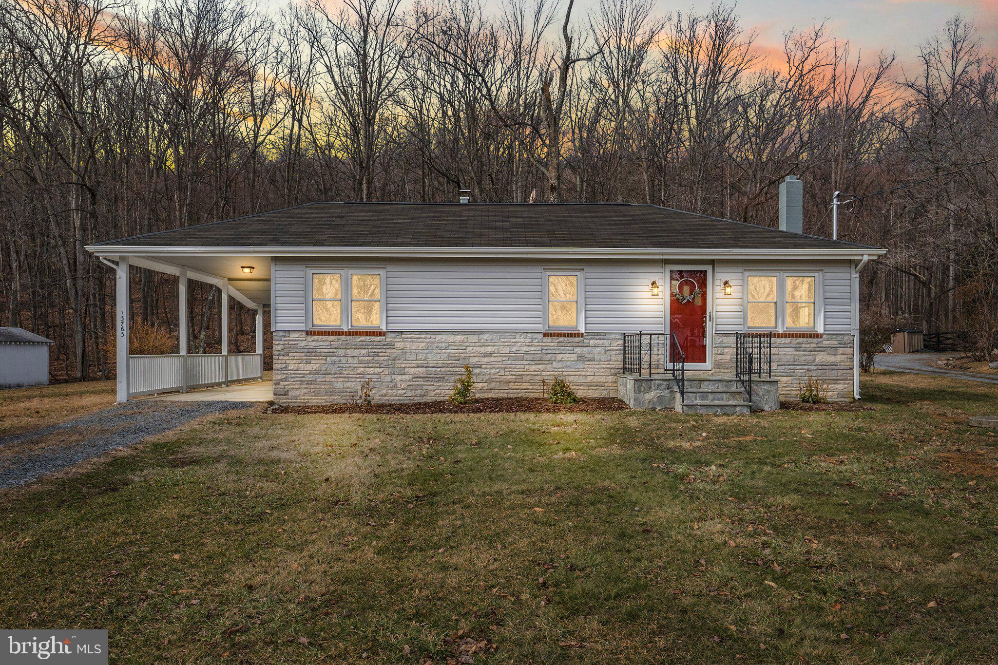 Welcome to 13763 Mountain Road, Hillsboro, Virginia—a perfect blend of history, charm, and modern convenience set on a serene 0.7-acre lot between Point of Rocks and Hillsboro. This thoughtfully updated country cottage was originally crafted by a skilled contractor for his family and has since been beautifully renovated to welcome yours.

Recent enhancements to the exterior include new siding, new roof, elegant stone steps, updated lighting, and lush landscaping. Inside, the removal of dropped ceilings adds to the home’s airy feel, complemented by lovingly restored heart of pine hardwood floors and original trim.

The primary bedroom now features a new bathroom and convenient laundry area, while the second bedroom offers a cozy retreat with a remote-controlled ceiling fan and a closet outfitted with built-in shelving. The kitchen has been modernized with brand-new cabinetry and appliances, plus a $2,000 seller allowance for a stove and refrigerator, giving you the freedom to personalize your culinary space.

A charming three-season porch with a Bluetooth light fixture invites you to unwind, while the versatile carport doubles as a delightful space for socializing. The backyard features two storage sheds, including one with double doors ideal for housing your lawn equipment.

Situated in the heart of Western Loudoun County, this move-in-ready home offers the tranquility of country living with convenient access to shopping, dining, wineries, breweries, and local attractions. Commuters will appreciate the easy access to Northern Virginia, Maryland, Washington, D.C., and Dulles International Airport, just 33 miles away. The MARC train in Brunswick, Maryland, is also only 10 miles from your doorstep.

Discover a harmonious blend of the past and present in this exceptional home. Schedule your private tour today.