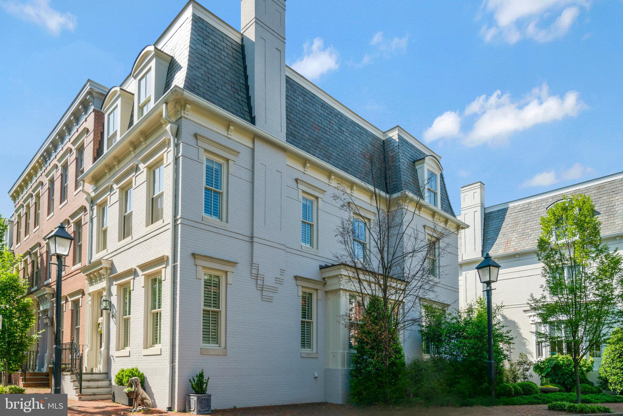 Welcome to the epitome of luxury living in the esteemed Backyard Boats community, nestled within the southeast quadrant of historic Old Town Alexandria overlooking lush parkland greenery and the picturesque Mt. Vernon Trail. This prestigious end unit residence, built in 2002, boasts an iconic mansard roof and represents the pinnacle of sophistication, offering the largest model in the neighborhood with 3,182 square feet of living space and unparalleled amenities.

Upon arrival, experience the utmost convenience with a private two-car garage, accessible through a secure gate, providing both security and peace of mind. As an added bonus, the garage is equipped with an electric vehicle charger, catering to the needs of environmentally conscious homeowners.

Step inside to discover a meticulously maintained interior, where every detail has been carefully curated to create a sense of luxury and comfort. The spacious open floor plan flows seamlessly from one room to the next, with ample natural light illuminating the living spaces. The gourmet kitchen serves as the heart of the home, featuring top-of-the-line appliances, quartz countertops, and custom cabinetry.

Adjacent to the kitchen, a flagstone patio awaits, offering a serene outdoor retreat perfect for al fresco dining or relaxing on warm summer evenings. This exceptional residence also offers the rare opportunity to install an elevator, providing convenient access to all four levels of the home. Whether you're hosting guests on the upper levels or simply looking to move between floors with ease, the option for an elevator adds an extra layer of luxury and convenience.

Convenience is paramount with this property, as it is situated on a private street with little through traffic, ensuring peace and tranquility. Additionally, enjoy the proximity to the charming shops and renowned restaurants of Old Town, as well as an easy commute to Washington, D.C., and convenient access to the airport and metro.