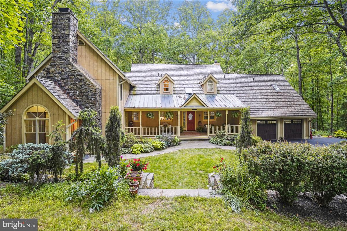If you are seeking a refuge from the hustle and bustle of city life, this is your home!  Set on 5 peaceful and idyllic acres with a stream, pond and a walking trail, your cares will melt away as you sit on the front porch or screened deck and watch the birds and wildlife or listen to the call of the owls.  This is a true manor with a gracious front lawn leading to the warm and inviting home.  Upon entering, you will be delighted by the contemporary elements and the open expanse of the home which has been thoughtfully designed to bring the natural beauty of the outdoors inside.  The living room and dining room are perfect for entertaining with a view, while the truly great room provides for a cozy ambience for casual nights while enjoying a roaring fire in the stone fireplace, or step out to the screened porch for outdoor dining.  With 5 bedrooms including dual master suites, there will be space everyone.  The lower level is complete with a spacious rec room, office and gym that opens to a large deck to enjoy this 5 acre paradise.  Exceptional schools:  Great Falls Elementary, Cooper Middle and Langley High School.  Wonderful location is just minutes to Great Falls Village, Georgetown Pike and Route 7,  Tysons and Reston.  Come experience this captivating lifestyle!