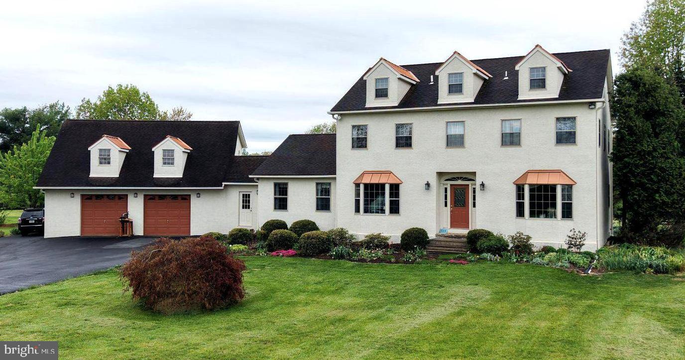 Location.  Location. Location.  Situated within the scenic landscapes of Upper Salford Township, the stately Colonial at 800 Diminjan Lane offers approximately 3,288 square feet of living space. This impressive residence offers multigenerational possibities with a flexible 11-room layout, featuring four bedrooms with the potential for two additional rooms on the finished third floor. The heart of the home is the open-concept kitchen, which centers around a functional island and flows effortlessly into the adjacent dining and living areas. For those who love to entertain, French doors lead directly from the kitchen to an outdoor grilling area, while a sophisticated den with vaulted ceilings and a dining room accented by a charming bay window provide ample space for both relaxation and formal gatherings.

This home is a masterpiece of eco-efficiency and high-performance infrastructure. It features a Geothermal HVAC system to provide ultra-efficient heating and cooling with a significantly reduced carbon footprint and lower utility costs. The exterior has been meticulously maintained for longevity featuring Rhino Shield, a flexible, waterproof ceramic elastomeric coating on the stucco and 50-year architectural shingle roof. Supported by a 200 AMP electrical service and a reliable 180-foot deep well, the structural integrity of the property is ready to welcome its new owner.

The exterior highlights continue with copper-toned window awnings, classic dormers, and a sweeping driveway leading to an oversized 864-square-foot garage. This expansive space provides ample room for vehicles and storage, with an additional 680 square feet of unfinished space above offering storage and additional possibilities.  Located on a quiet 1.55-acre cul-de-sac, the property benefits from a premier location within the highly-regarded Souderton Area School District. Residents will enjoy being just minutes from the Perkiomen Trail and the Pennsylvania Turnpike, as well as the boutique charm and dining of nearby Harleysville and Skippack.