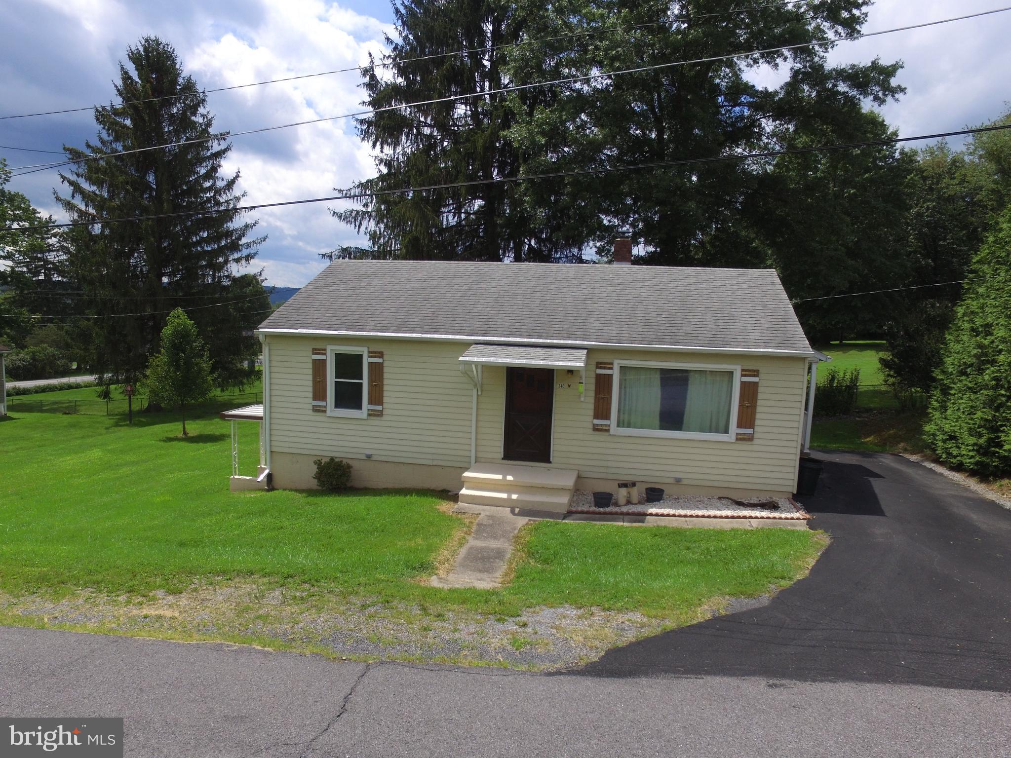 Wonderful 3-bedroom ranch home on a double lot in a quiet neighborhood. This adorable house features hardwood floors, a large living room, lots of light, a beautifully kept yard, and a walk-out basement. In addition to the property being well maintained, the owners recently replaced the roof, windows, furnace and added a new 200-amp electric service. There's an AC unit included that can be inexpensively hooked up. Because of the double lot, there's plenty of room to add to the existing house. One can build an addition and keep it single story or build up as the ceiling joists are 2 x 12's. The basement is very dry and could also be turned into a finished space. Close to Juniata College, the High School, shopping, and parks! The house is vacant. Short-notice showings are ok.
