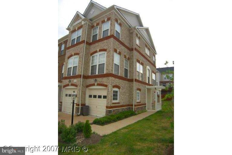Huge end unit town house; fully fenced yard; brick paver patio; huge deck across back of home; brick front & side of home; extensions on all 3 levels; hardwood floors in kitchen, breakfast room and family room; kitchen with upgraded cabinets & counters; master bedroom with sitting room & walk in closet; luxury master bathroom.
