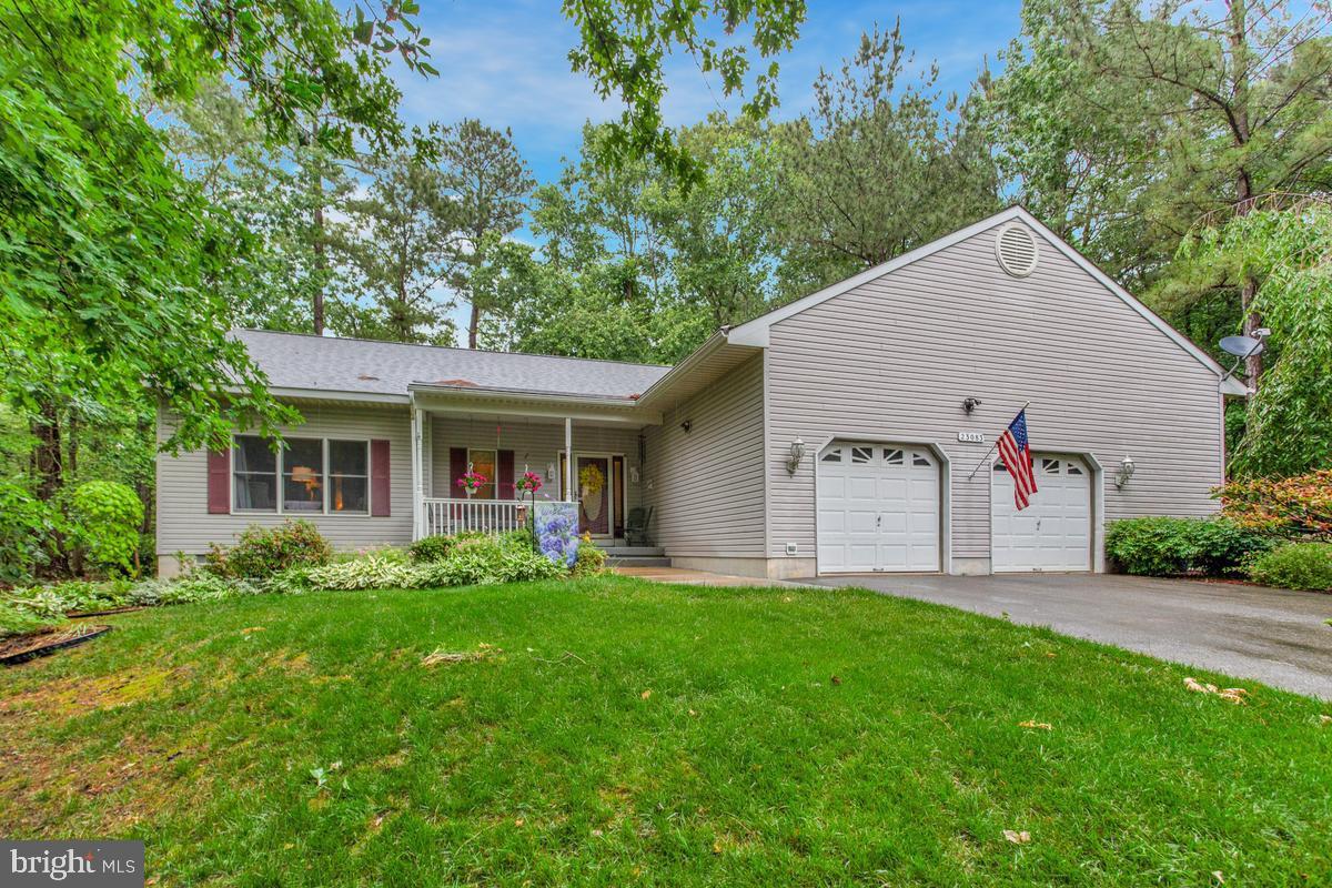 FANTASTIC Rambler in Pepper Ridge of Wildewood! Custom exposed wood-beam cathedral ceiling, open floor plan, oversized garage with fixed staircase to loft for storage and an encapsulated crawl space! *Roof is 2 years young* One-level living made easy with the primary owner's suite having a renovated full bathroom with heated floors. Open kitchen concept! Cabinets provide counter lighting, tile backsplash and granite counters. *New garbage disposal* No carpet in this house -  Hardwood throughout main level and owner’s suite and LVP in secondary bedrooms. Generous closet spaces throughout the home and separate laundry room with under cabinet lighting adds even more storage options. Lovely yard with outdoor lighting  great location!