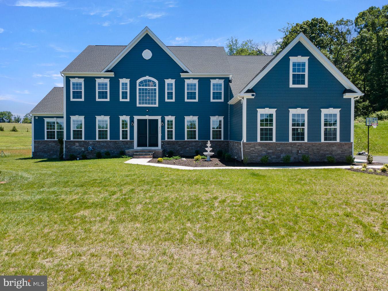 Welcome to an extraordinary luxury estate in Aldie's coveted Tanager community, where timeless elegance, exceptional craftsmanship, and resort-style amenities come together on a breathtaking 1.74-acre homesite. Boasting over 9,000 square feet of meticulously designed living space, this remarkable residence offers an unparalleled lifestyle for the most discerning buyer.

From the moment you enter, you'll be captivated by the grand scale, soaring ceilings, abundant natural light, and thoughtfully curated finishes throughout. Designed for both sophisticated entertaining and comfortable everyday living, the expansive floor plan seamlessly blends formal and casual spaces while delivering the functionality today's luxury buyers demand.  Laundry located on each level for convenience and utility.

At the heart of the home, the gourmet chef's kitchen opens to spacious gathering areas, creating the perfect setting for hosting family and friends. The luxurious primary suite serves as a private retreat with a spa-inspired bath and expansive walk-in closets, while generously sized secondary bedrooms and multiple living areas provide comfort and flexibility for every stage of life.

The true showpiece of this home is the spectacular lower level, where over $200,000 in premium upgrades have transformed the space into a one-of-a-kind entertainment destination. Enjoy an incredible custom home theater for immersive movie nights, along with beautifully finished recreation and gathering spaces designed for entertaining on a grand scale. Whether hosting game days, celebrations, or intimate gatherings, this level delivers an experience rarely found in residential real estate.

Outside, the expansive grounds offer privacy, serenity, and endless possibilities for outdoor enjoyment. Surrounded by picturesque Loudoun County scenery yet conveniently located near shopping, dining, wineries, top-rated schools, and major commuter routes, this estate provides the perfect balance of luxury, convenience, and tranquility.

A rare offering combining over 9,000 square feet of refined living space, nearly two acres of land, and over $200,000 in custom lower-level enhancements, this is a home that must be experienced to be fully appreciated.