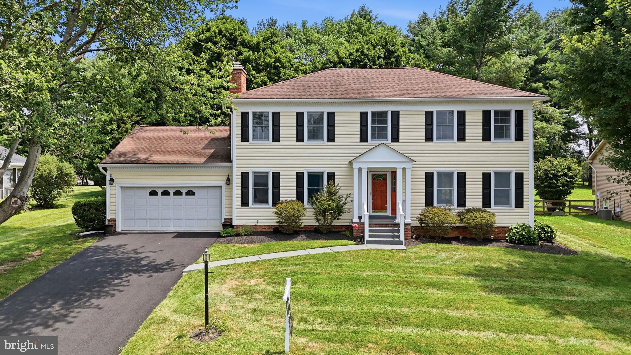 Located in the beautiful community of Hamilton Acres, a peaceful, upscale neighborhood in the heart of historic Hamilton, Va. This gorgeous 4 bedroom 2.5 bath colonial is nestled amongst mature trees and landscaping on a private cul-de-sac to bring the comfort and feel of your own oasis.   Well loved and maintained throughout the years.  The home boasts gleaming hardwood floors and tile on the main level.  A brick, wood burning fireplace in the family room offers a cozy escape from the hustle and bustle on those cool fall and winter days/nights. Cherry cabinets and stainless steel appliances in the kitchen with a sliding door that leads to a large deck perfect for entertaining.  The Owner's suite and secondary bathroom have been elegantly updated and appointed. The partially finished basement served as a media room/den with plenty of space to complete and make your own.  
Just minutes from great shops, amazing restaurants and entertainment in downtown Leesburg and Purcellville. This charming colonial is ready to make yours - Welcome Home!