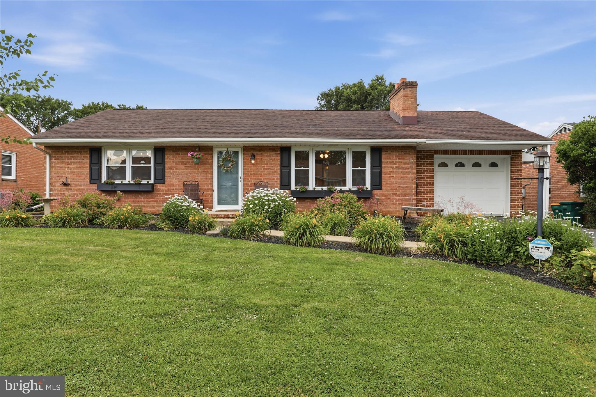 Charming, well-kept brick rancher offering 3 bedrooms, 1 full bath, and a 1-car attached garage with large driveway.  

The living room includes luxury vinyl plank flooring, a pellet stove, and a bay window. The kitchen features beautiful oak cabinets and stainless steel appliances. All three bedrooms offer luxury vinyl plank flooring.

Additional features include a spacious unfinished basement, a large backyard, and ample storage space. Property is being sold AS-IS. Ready for its next owner!